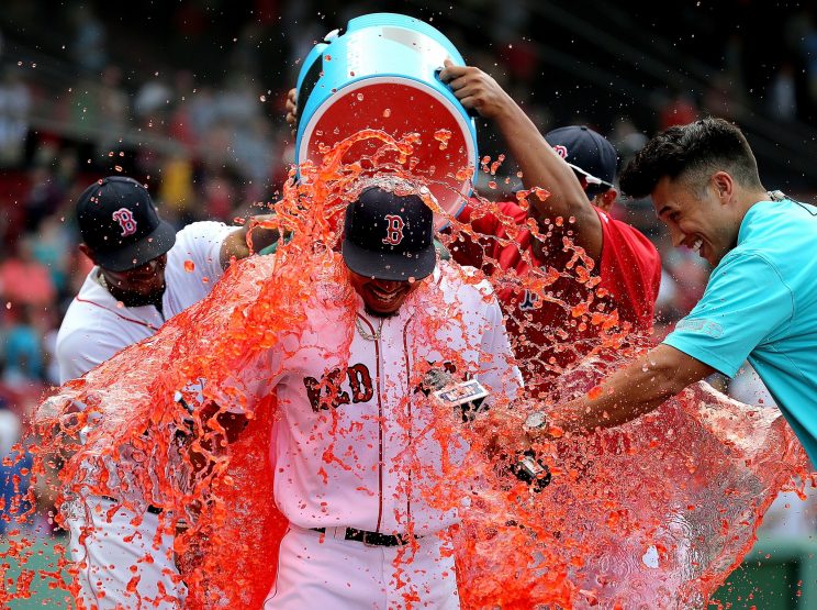 Mookie Betts celebrates after blasting three home runs in one game. (Getty Images/Jim Rogash)