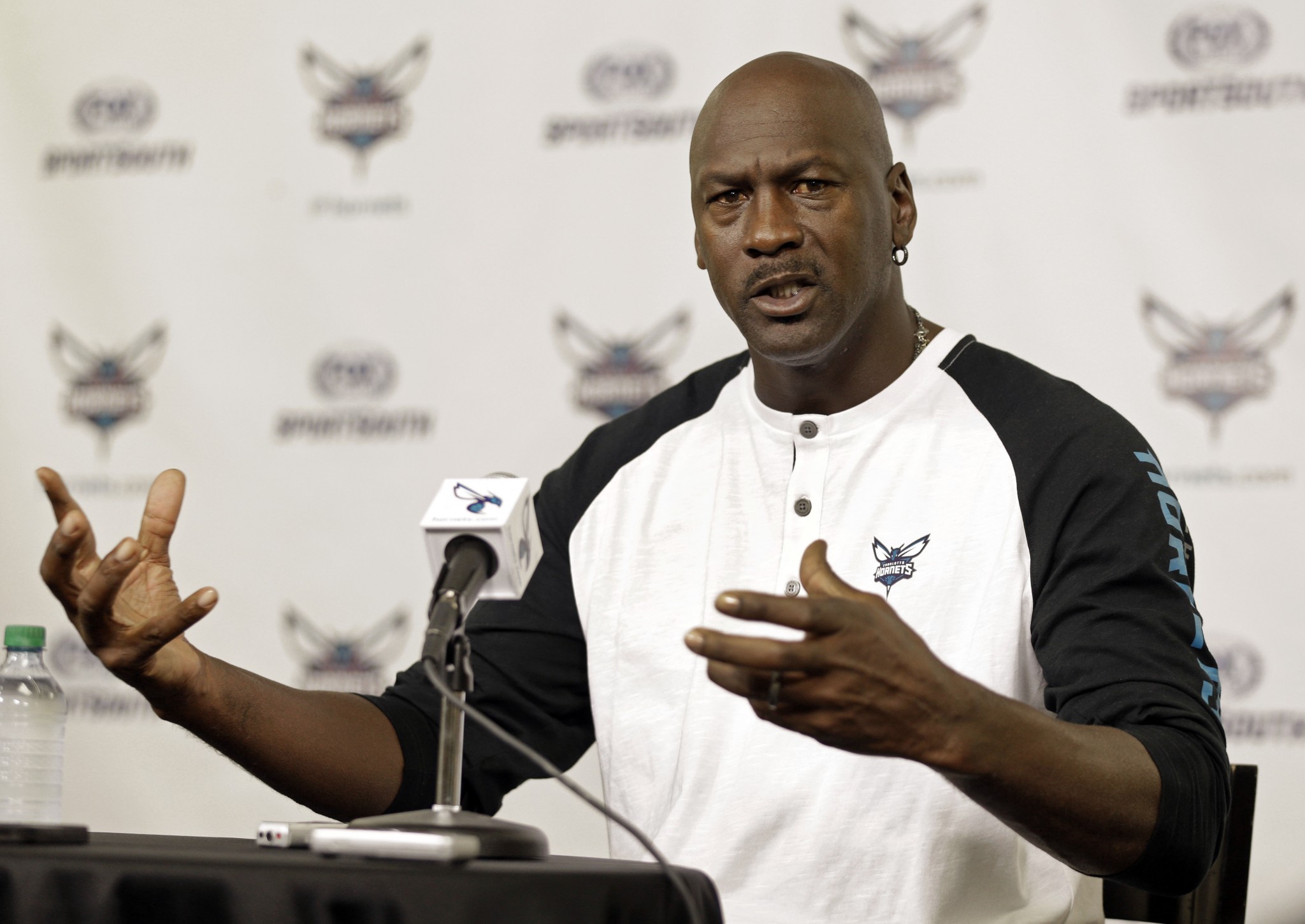 Charlotte Hornets owner Michael Jordan answers a question during an Oct. 28, 2014, news conference. (AP/Chuck Burton)