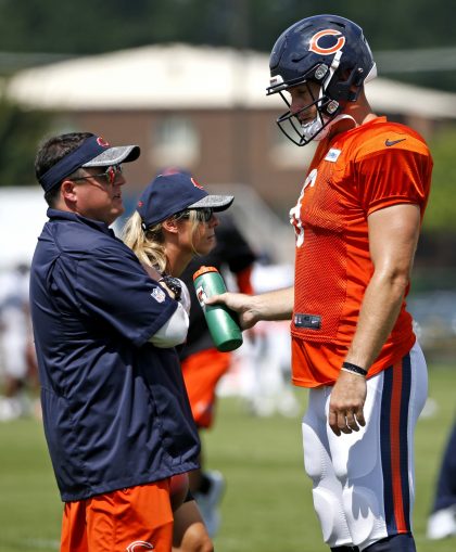 Jay Cutler (left) and Chicago Bears offensive coordinator Dowell Loggains chat in camp (AP).
