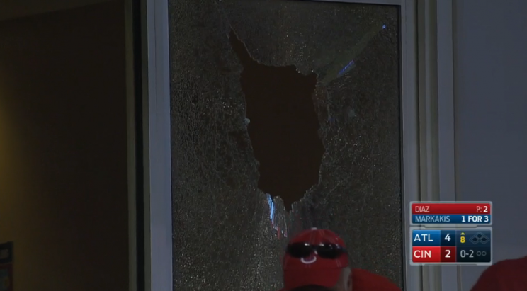 A window shattered by Nick Markakis during the Atlanta Braves vs Cincinnati Reds game on July 19, 2016