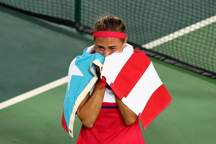 Monica Puig of Puerto Rico reacts after defeating Angelique Kerber of Germany. (Getty)