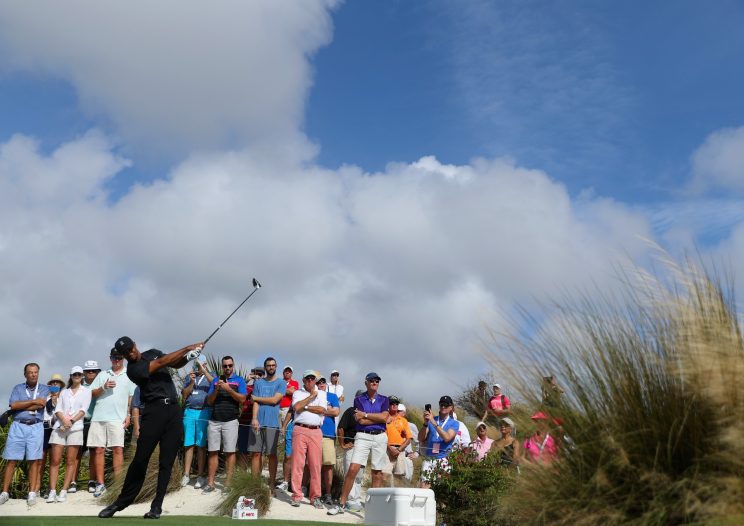 Tiger Woods tees off at the Hero World Challenge, marking his return to competitive play after a 16-month layoff. (Getty Images)