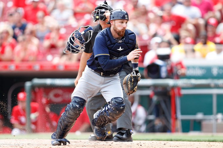 CINCINNATI, OH - JULY 17: Jonathan Lucroy #20 of the Milwaukee Brewers chases a wild pitch that allowed Billy Hamilton of the Cincinnati Reds to score the winning run in the ninth inning at Great American Ball Park on July 17, 2016 in Cincinnati, Ohio. The Reds defeated the Brewers 1-0. (Photo by Joe Robbins/Getty Images)