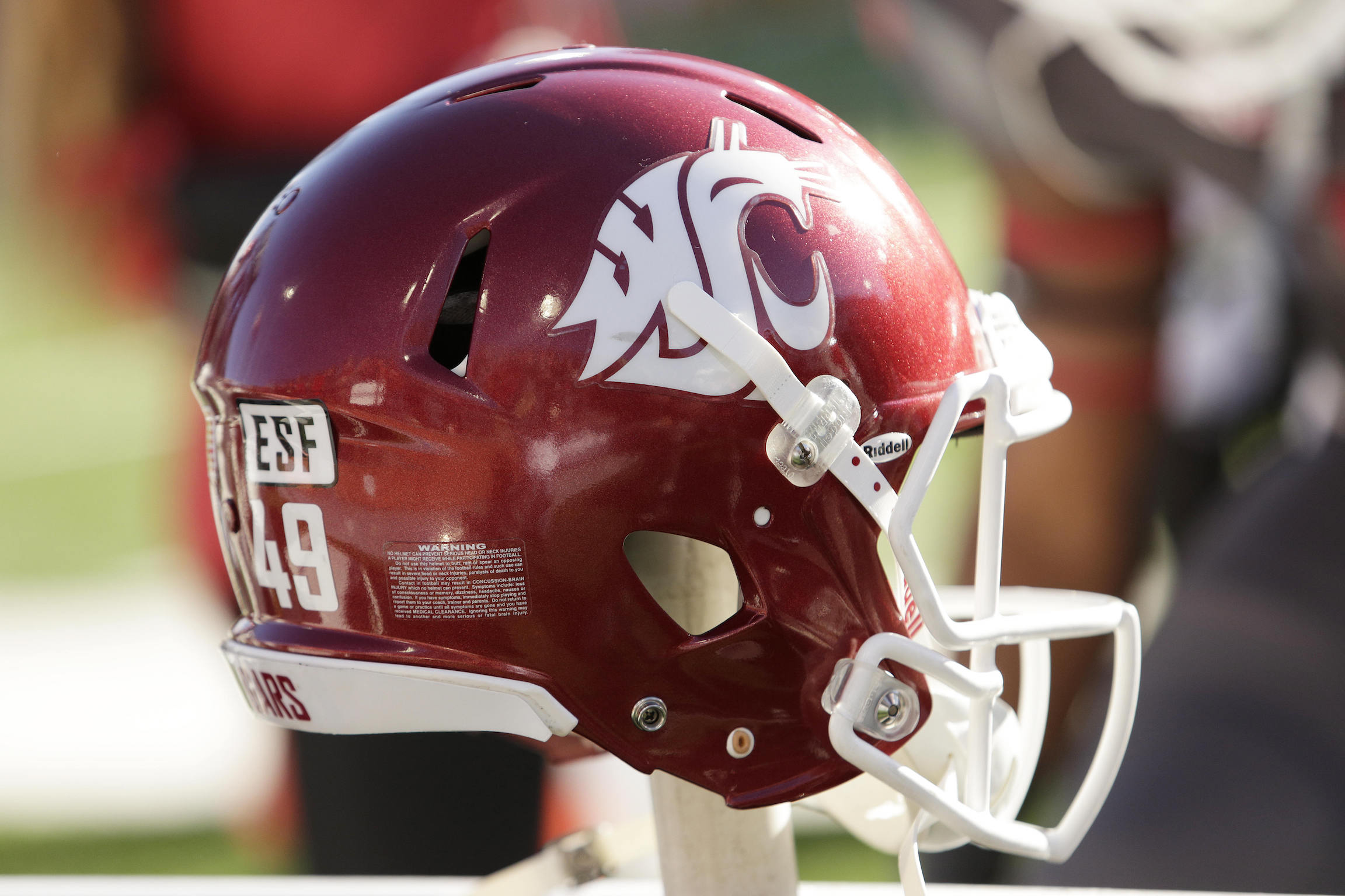A Washington State helmet sits on a stand before an NCAA college football game, Saturday, Nov. 7, 2015, in Pullman, Wash. (AP Photo/Young Kwak)
