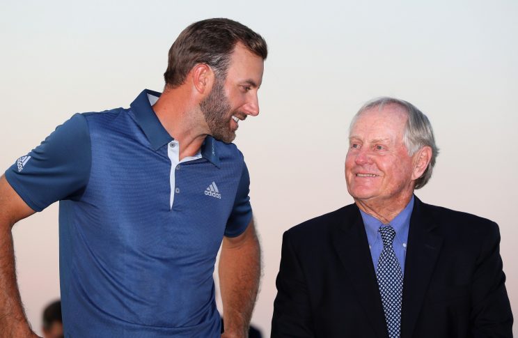 Jack Nicklaus speaks to Dustin Johnson at the U.S. Open trophy presentation in June. (Getty Images)