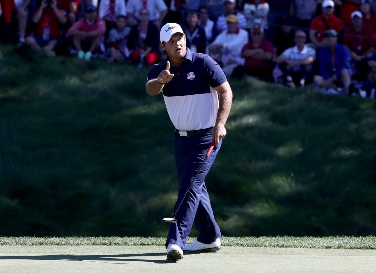 Patrick Reed wags his finger at Rory McIlroy after draining a birdie on the eighth. (Getty Images)