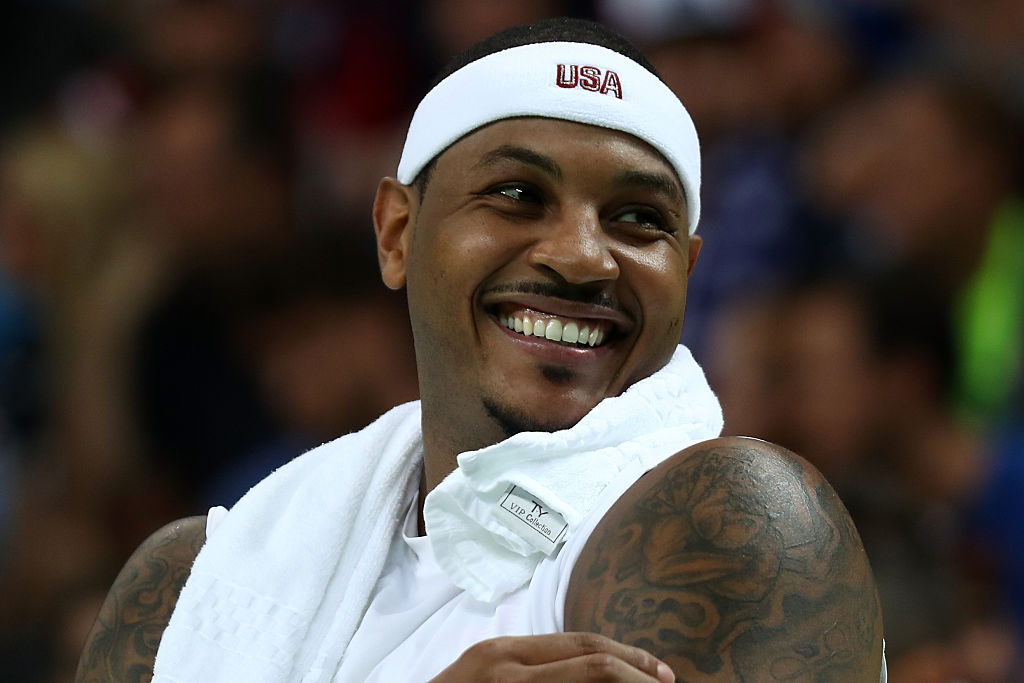 Carmelo Anthony takes a moment during Team USA's win over Venezuela to reflect on how happy he is. (Bryn Lennon/Getty Images)