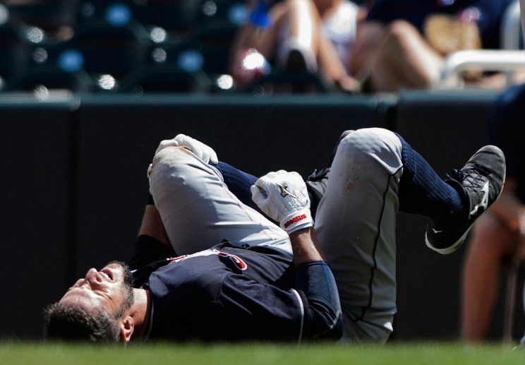 MINNEAPOLIS, MN - JULY 17: Yan Gomes #10 of the Cleveland Indians reacts after being injured on a play at first base during the fifth inning of the game against the Minnesota Twins on July 17, 2016 at Target Field in Minneapolis, Minnesota. (Photo by Hannah Foslien/Getty Images)