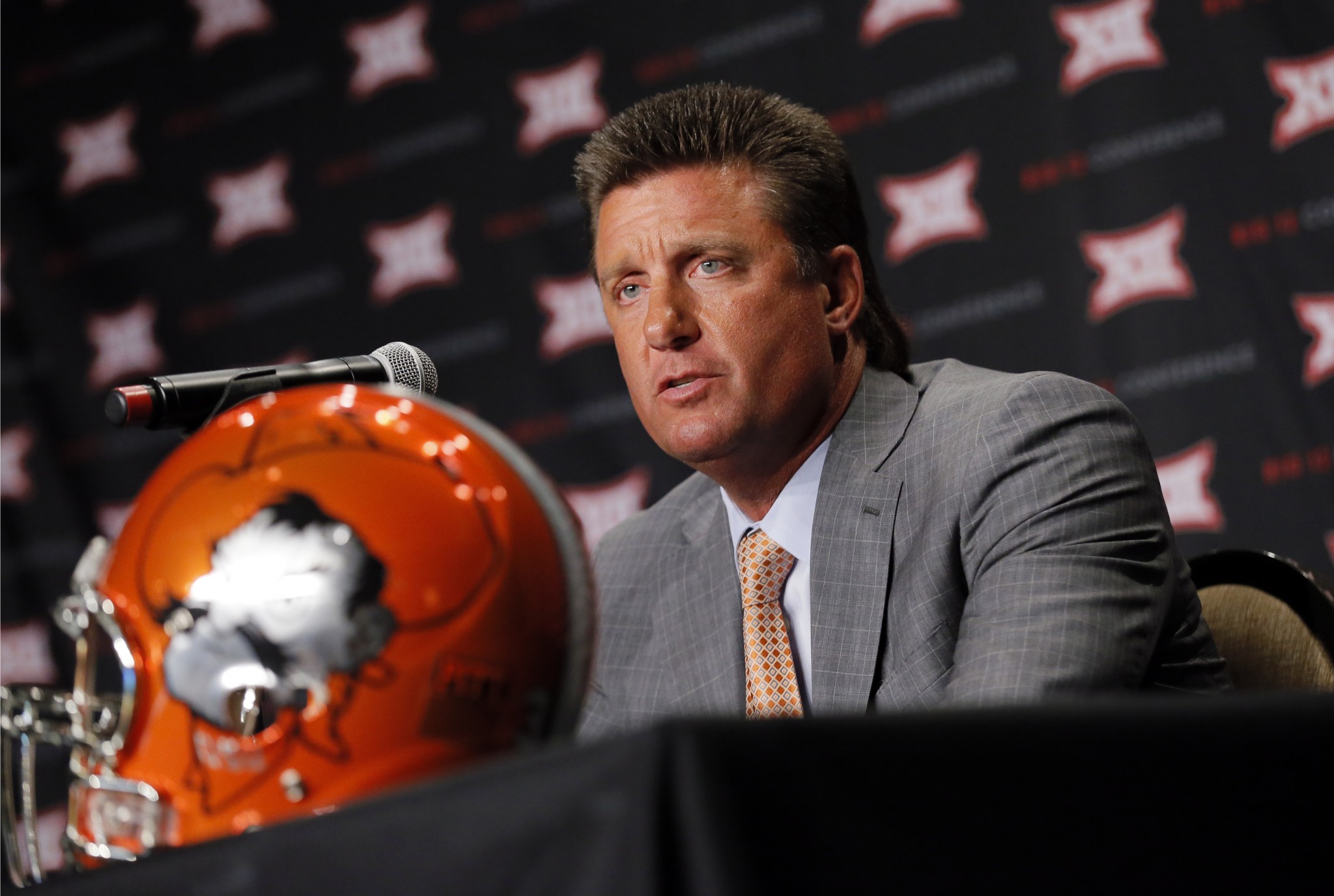 Oklahoma State head football coach Mike Gundy responds to questions during Big 12 media days, Monday, July 18, 2016, in Dallas. (AP Photo/Tony Gutierrez)