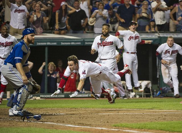 Tyler Naquin dives home to complete his memorable inside-the-park home run. (AP)