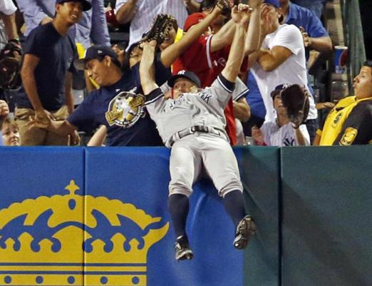 Brett Gardner of the Yankees makes a crazy catch to rob the Angels' C.J. Cron of a home run. (AP)