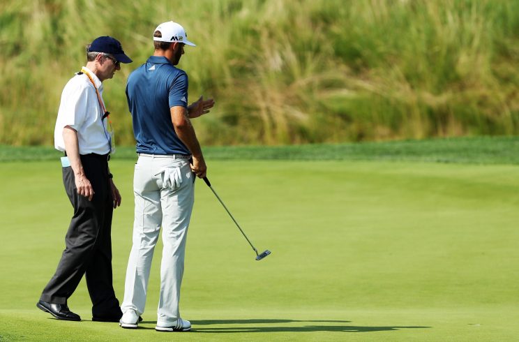 Dustin Johnson was pleading his case to a USGA rules official at the U.S. Open. (Getty Images)
