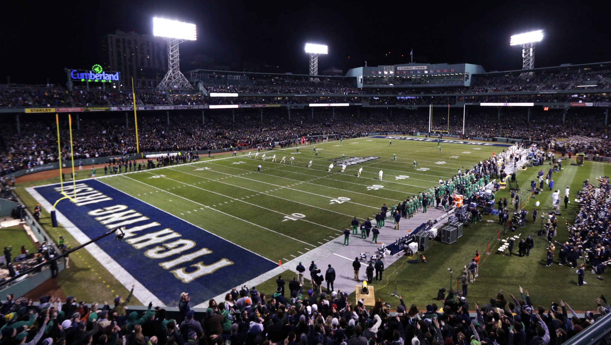 Boston College kicks to Notre Dame on the opening kickoff during the first quarter of the Shamrock Series NCAA college football game at Fenway Park, home of the Boston Red Sox, in Boston Saturday, Nov. 21, 2015. (AP Photo/Charles Krupa)