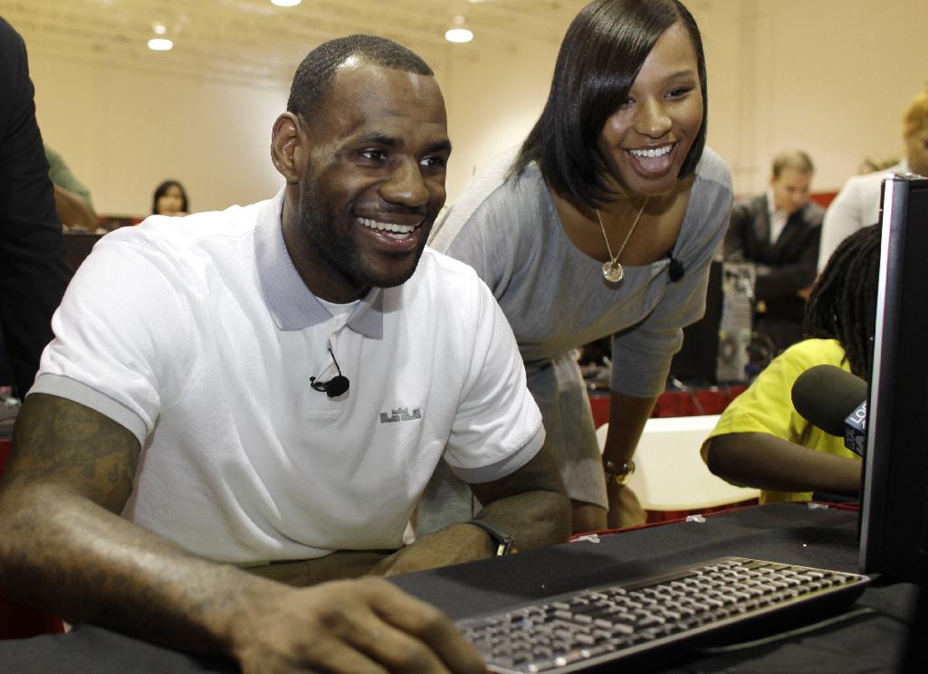 LeBron James and wife Savannah Brinson surf the Information Superhighway. (AP/Lynne Sladky, File)