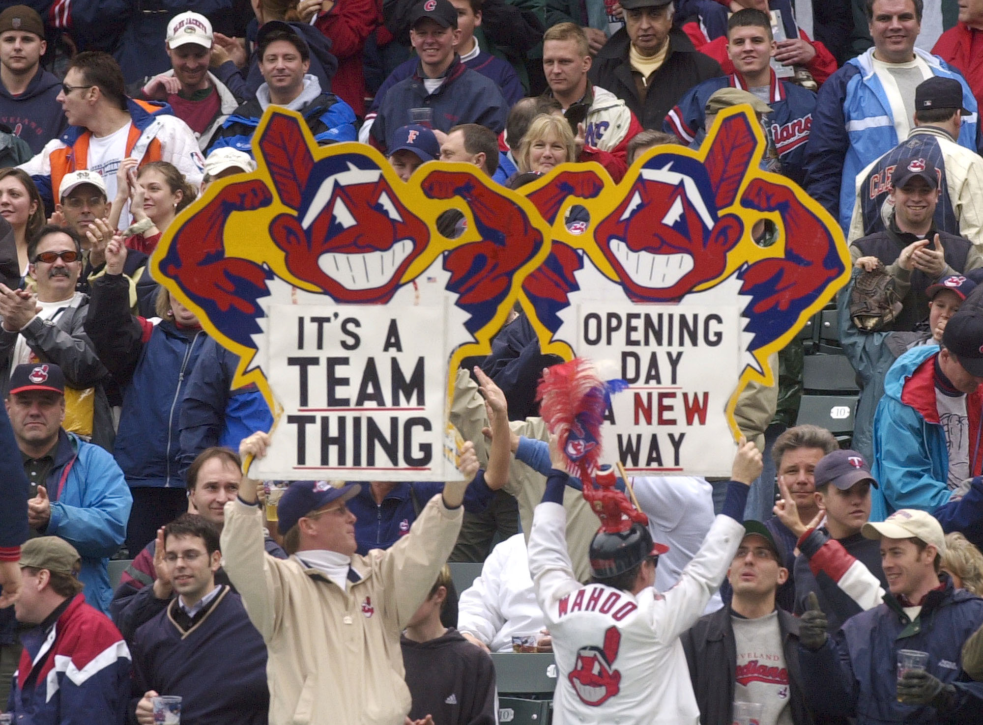 From 2002: Cleveland Indians fans hold up signs with Chief Wahoo on them. (AP)