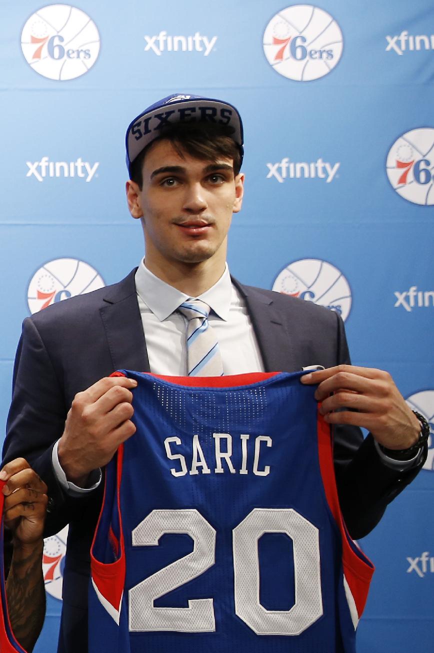 Newly-drafted Philadelphia 76ers' Dario Saric poses for a photo after a basketball news conference at the team's practice facility, Saturday, June 28, 2014, in Philadelphia. (AP Photo/Matt Slocum)