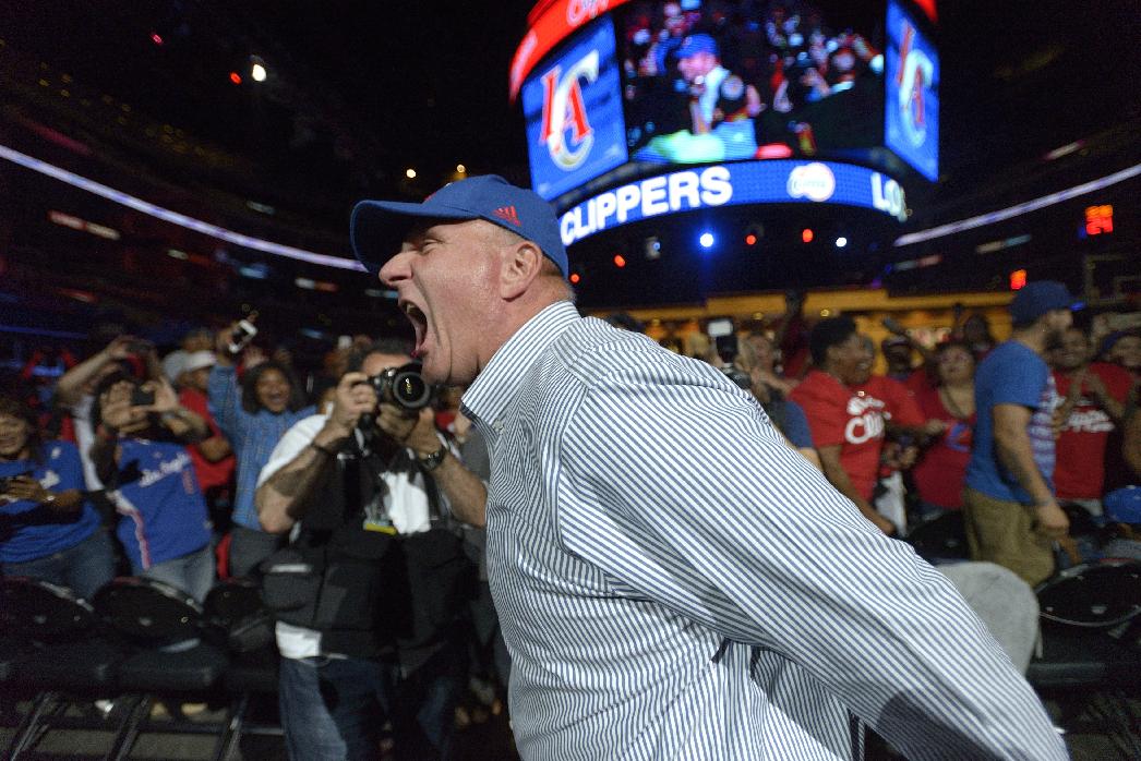 Steve Ballmer, the new owner of the Los Angeles Clippers, greets fans as he enters a fan festival at the Staples Center in Los Angeles, Monday, Aug. 18, 2014, in Los Angeles. (AP Photo/The Orange County Register, Jeff Gritchen)