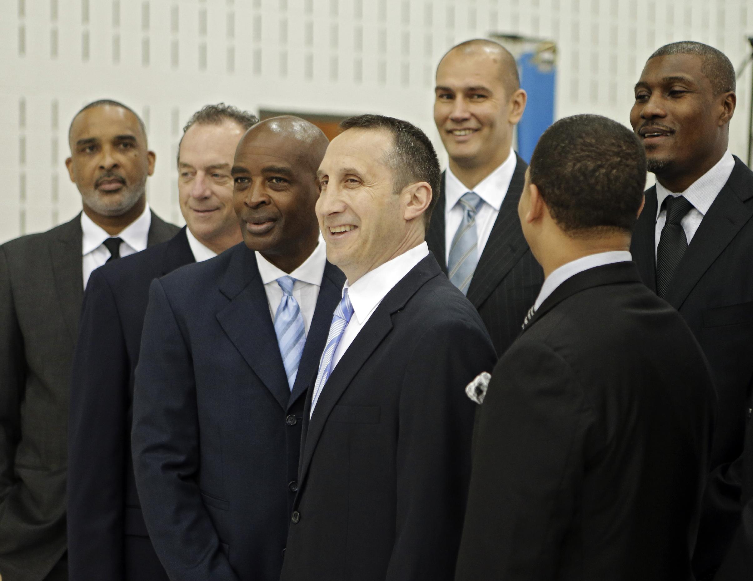 Cleveland Cavaliers head coach David Blatt, center, poses with his assistant coaches at the NBA basketball team's practice facility in Independence, Ohio  Friday, Sept. 26, 2014. (AP Photo/Mark Duncan)