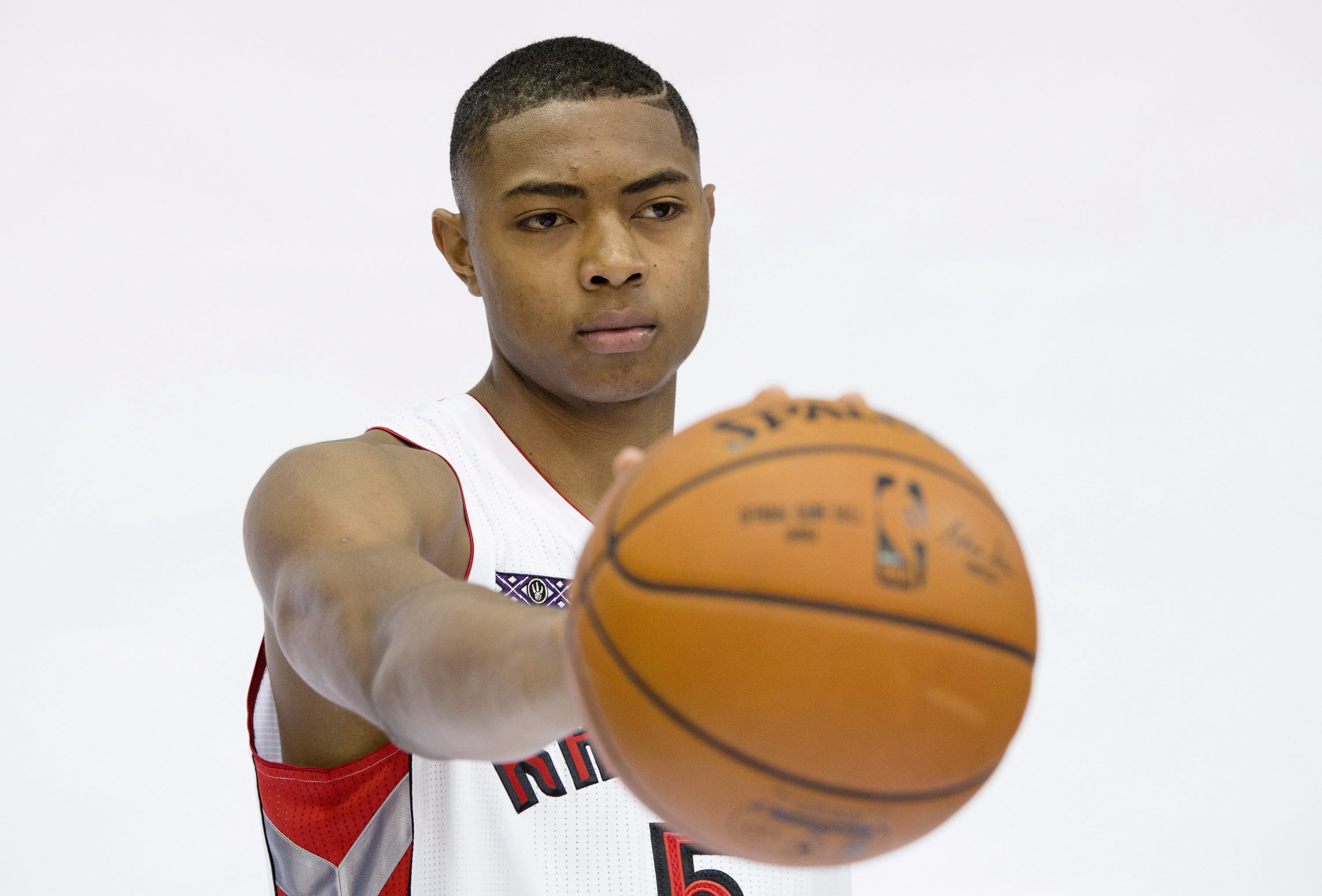 Toronto Raptors' Bruno Caboclo poses for photos during the NBA basketball team's media day at the Air Canada Centre in Toronto, Monday, Sept. 29, 2014. (AP Photo/The Canadian Press, Darren Calabrese)