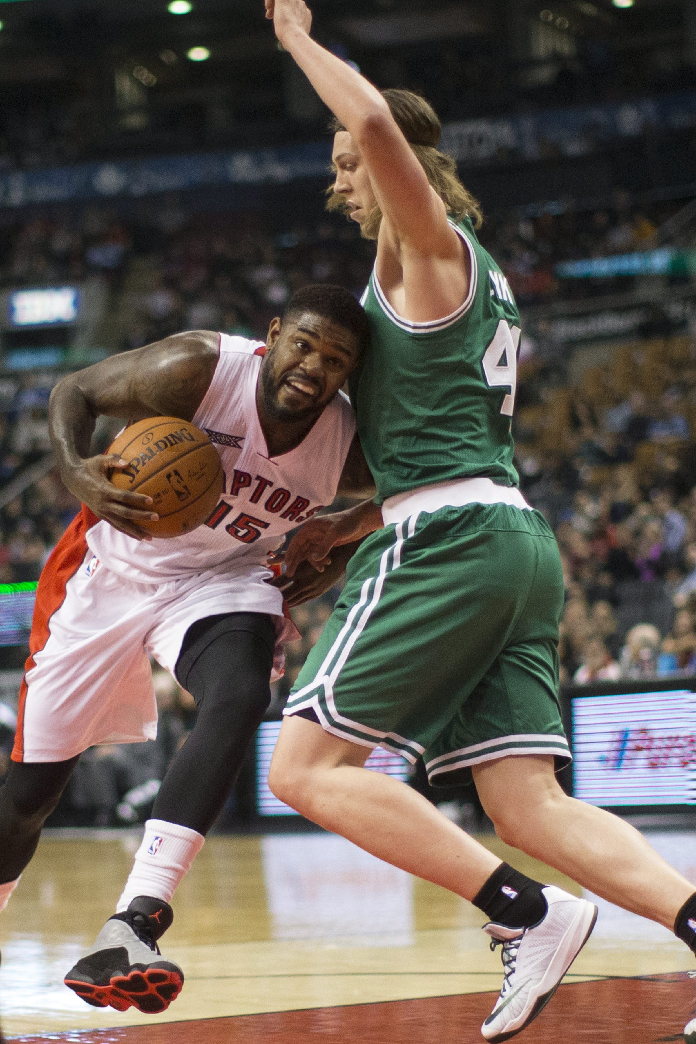 Amir Johnson nuzzles future teammate Kelly Olynyk. (AP Photo/The Canadian Press, Chris Young)