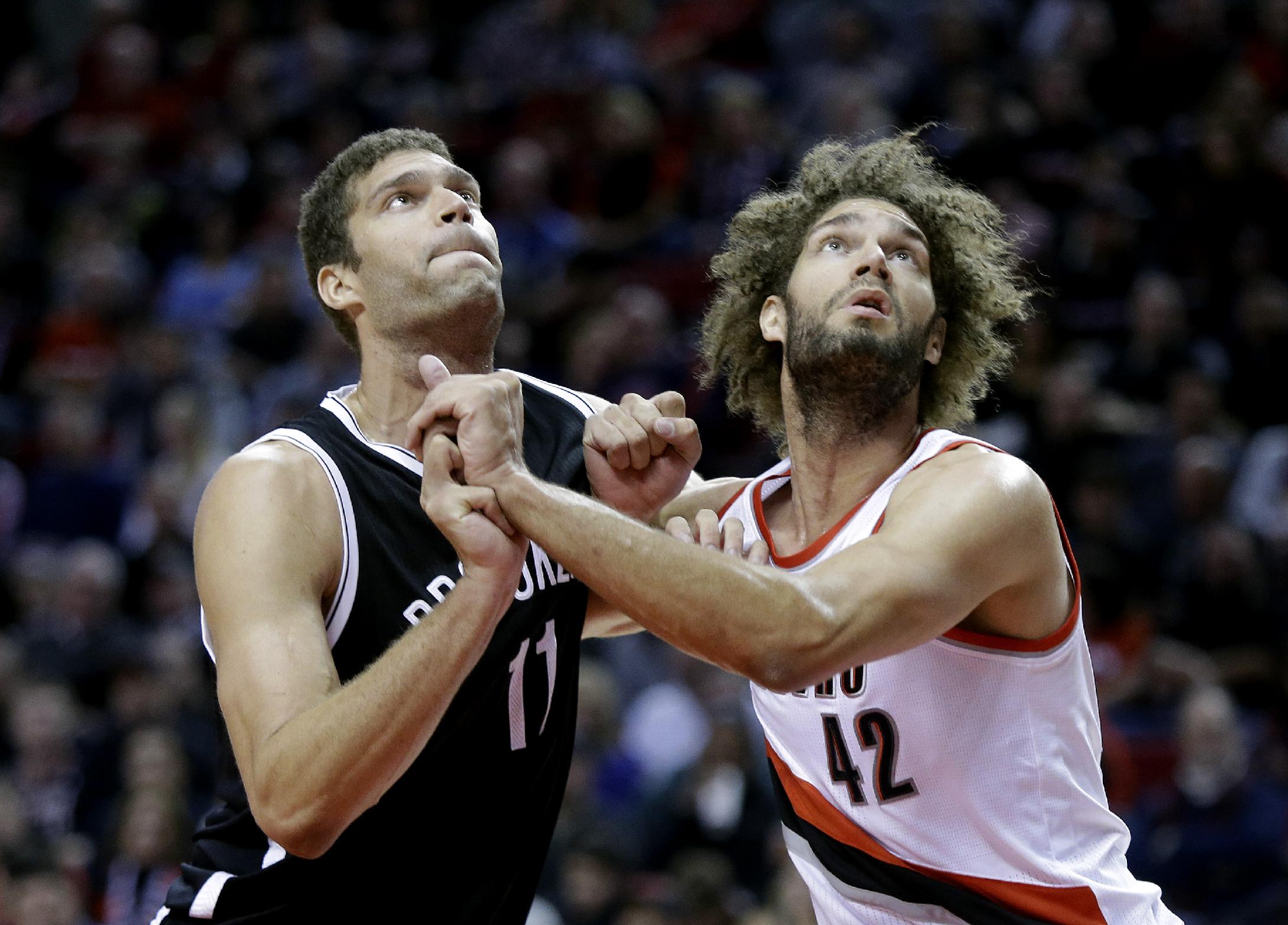 Robin Lopez is set to join his twin brother Brook in the Big Apple. (AP/Don Ryan)