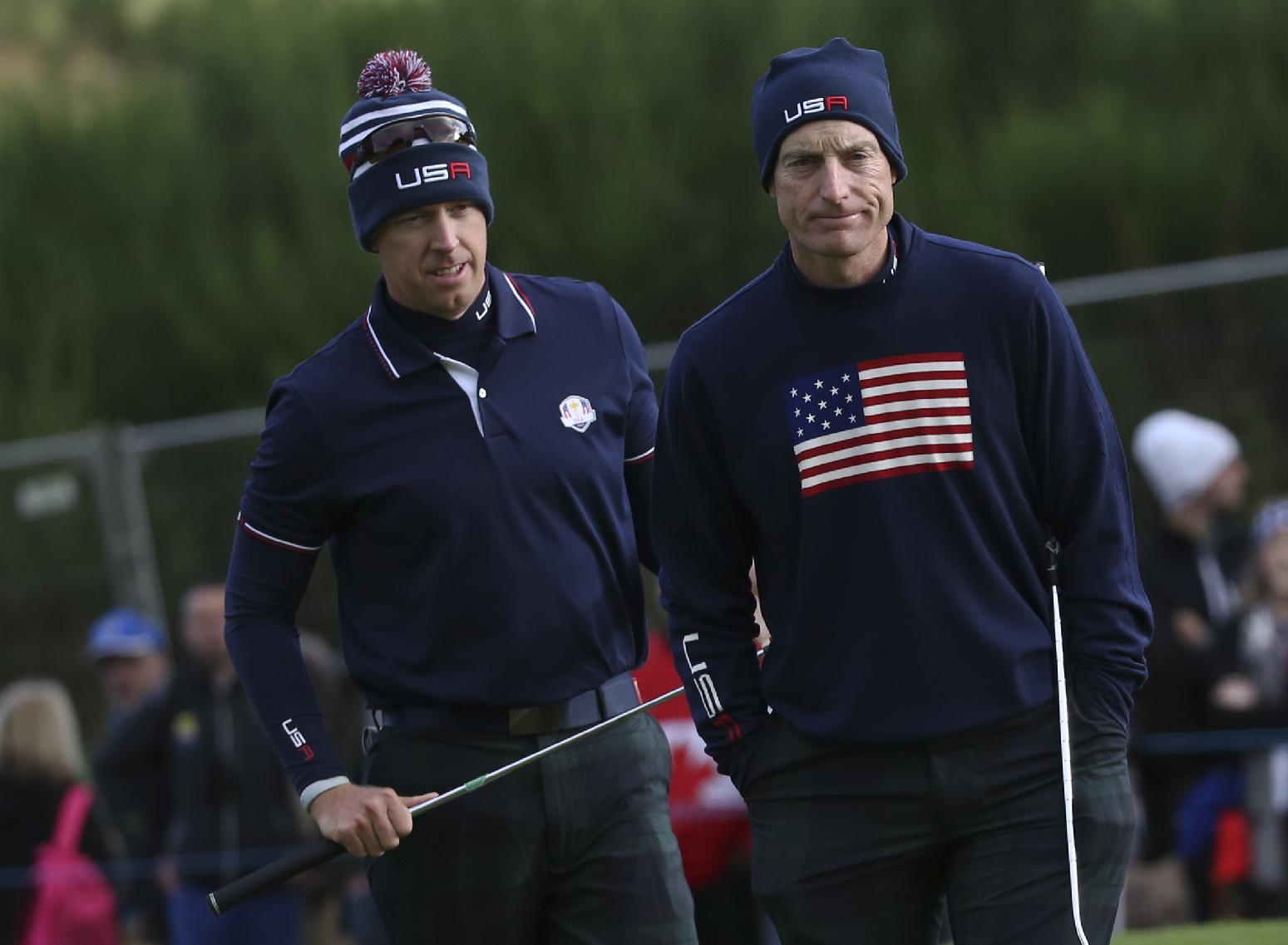 Hunter Mahan, left, and Jim Furyk of the US wait to putt on the 6th green during the fourball match on the second day of the Ryder Cup golf tournament, at Gleneagles, Scotland, Saturday, Sept. 27, 2014. (AP Photo/Scott Heppell)
