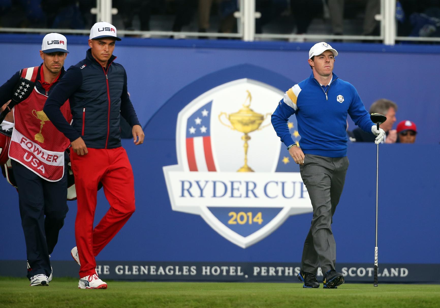 Europe's Rory McIlroy, right, and Rickie Fowler of the US prepare to play off the fire tee during the singles match on the final day of the Ryder Cup golf tournament at Gleneagles, Scotland, Sunday, Sept. 28, 2014. (AP Photo/Scott Heppell)