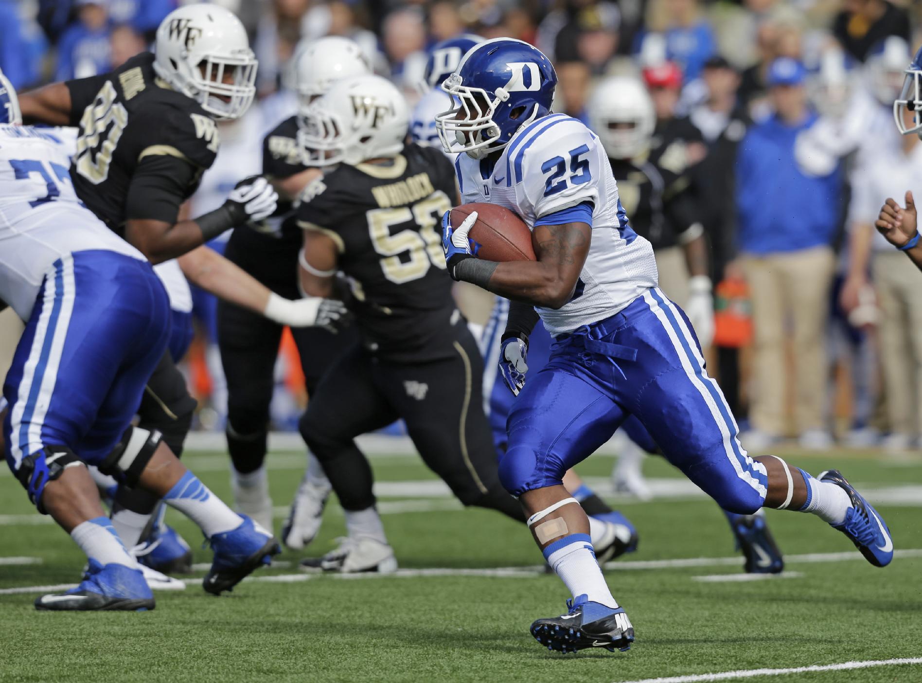 Duke running back Jela Duncan (25) runs against Wake Forest during the first half of an NCAA college football game in Winston-Salem, N.C., Saturday, Nov. 23, 2013. Duke won 28-21. (AP Photo/Chuck Burton)