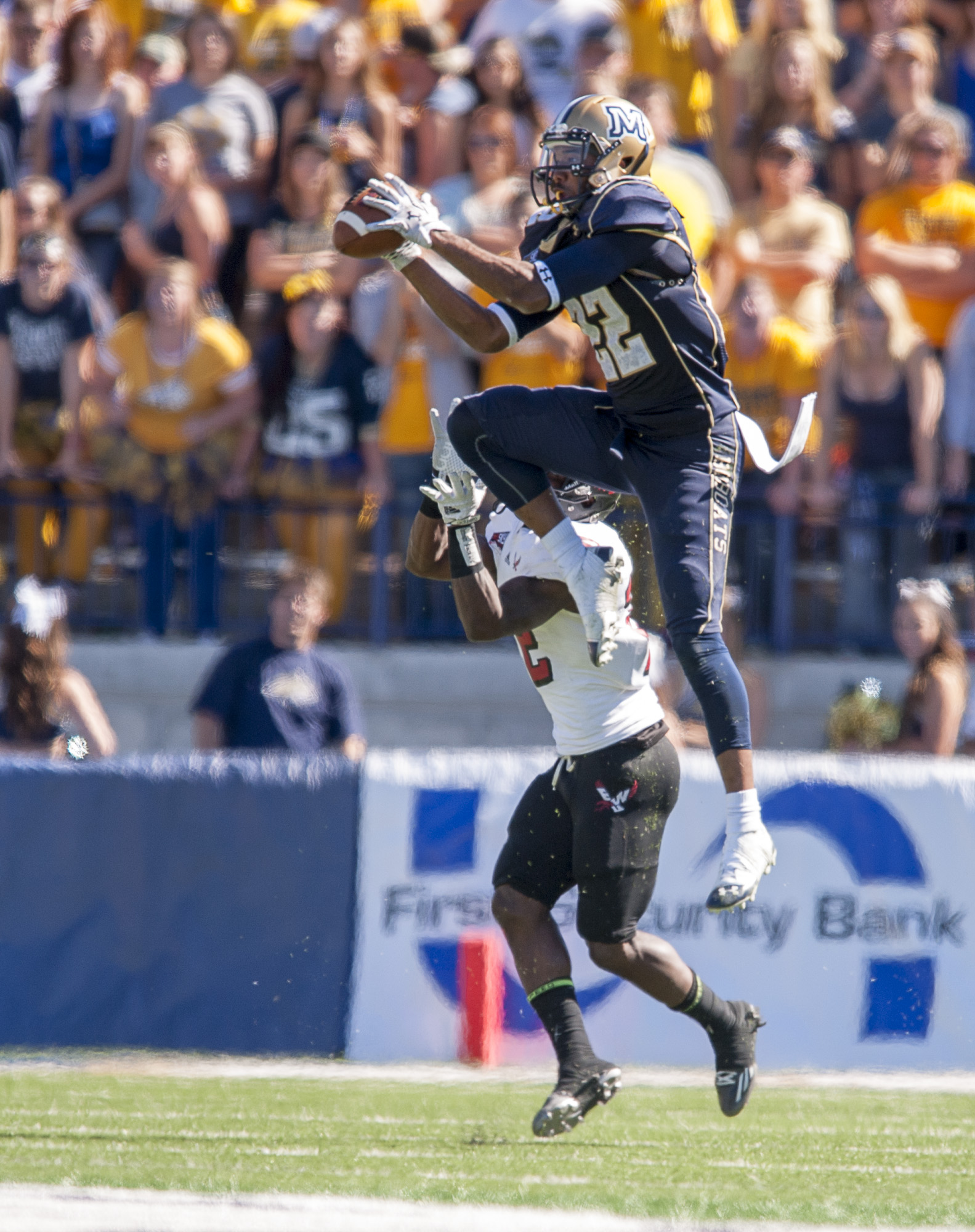 Montana State safety Eryon Barnett, top, jumps for an interception late in the first half of an NCAA college football game against Eastern Washington, Saturday, Sept. 20, 2014, in Bozeman, Mont. (AP Photo/Montana State University, Kelly Gorham)