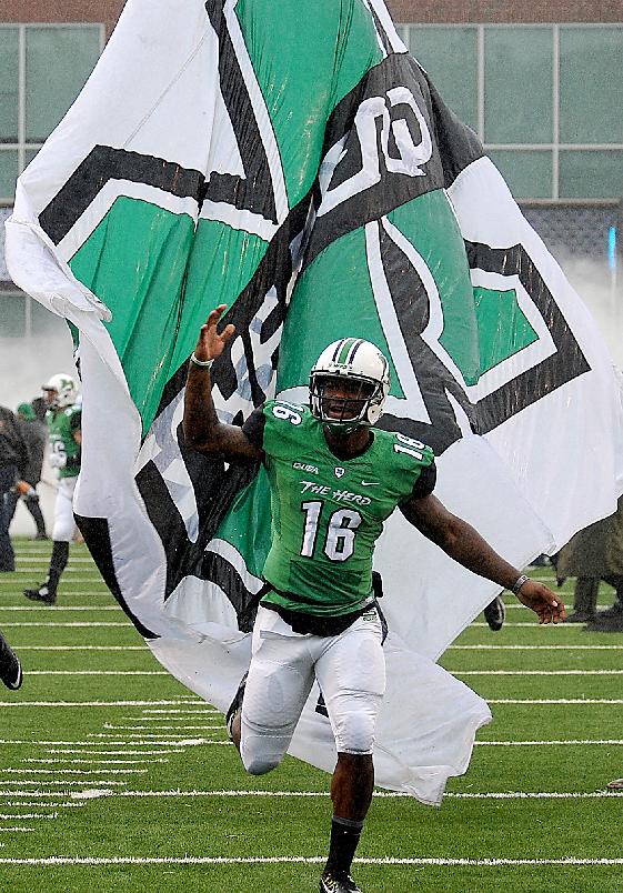 Marshall's Deon-Tay McManus runs onto the field just before the Conference USA championship NCAA college football game against Louisiana Teach in Huntington, W.Va., Saturday Dec. 6, 2014. (AP Photo/Chris Tilley)