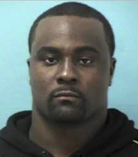 This booking photo released by the Franklin, Tenn., Police Department shows Shonn Greene of the Tennessee Titans NFL football team. Greene was arrested Friday, Oct. 24, 2014, for allegedly parking in a handicapped space and speeding away when an officer was issuing him a citation. Franklin, Tennessee police Sgt. Charles Warner says Greene was charged with driving on a suspended license, reckless driving, failure to stop/halt/frisk and illegal parking.  Greene was released on $2,000 bond. He is due in court Nov. 13. (AP Photo/Franklin, Tenn., Police Department)