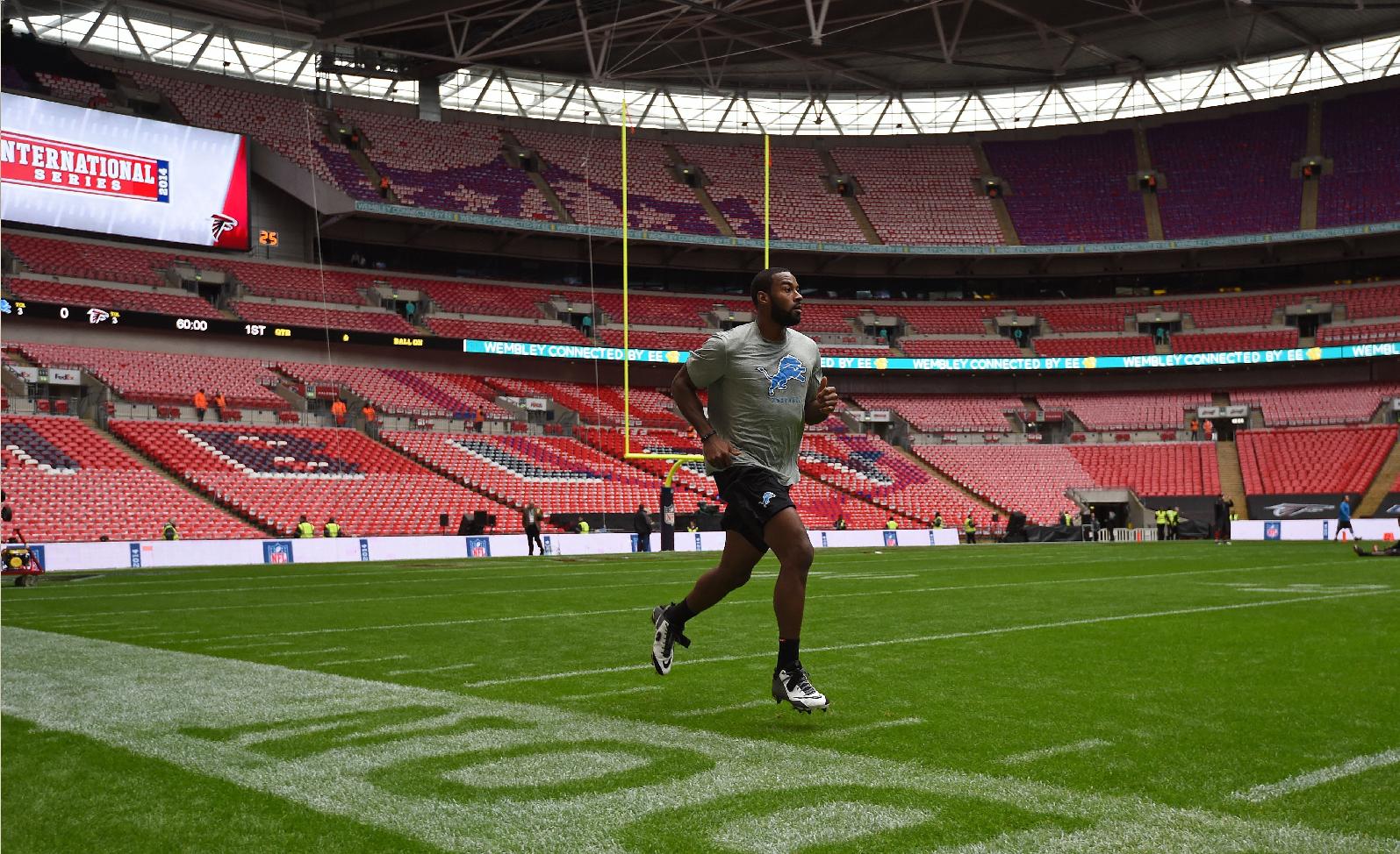 Calvin Johnson warms up before Sunday's game against Atlanta (AP)