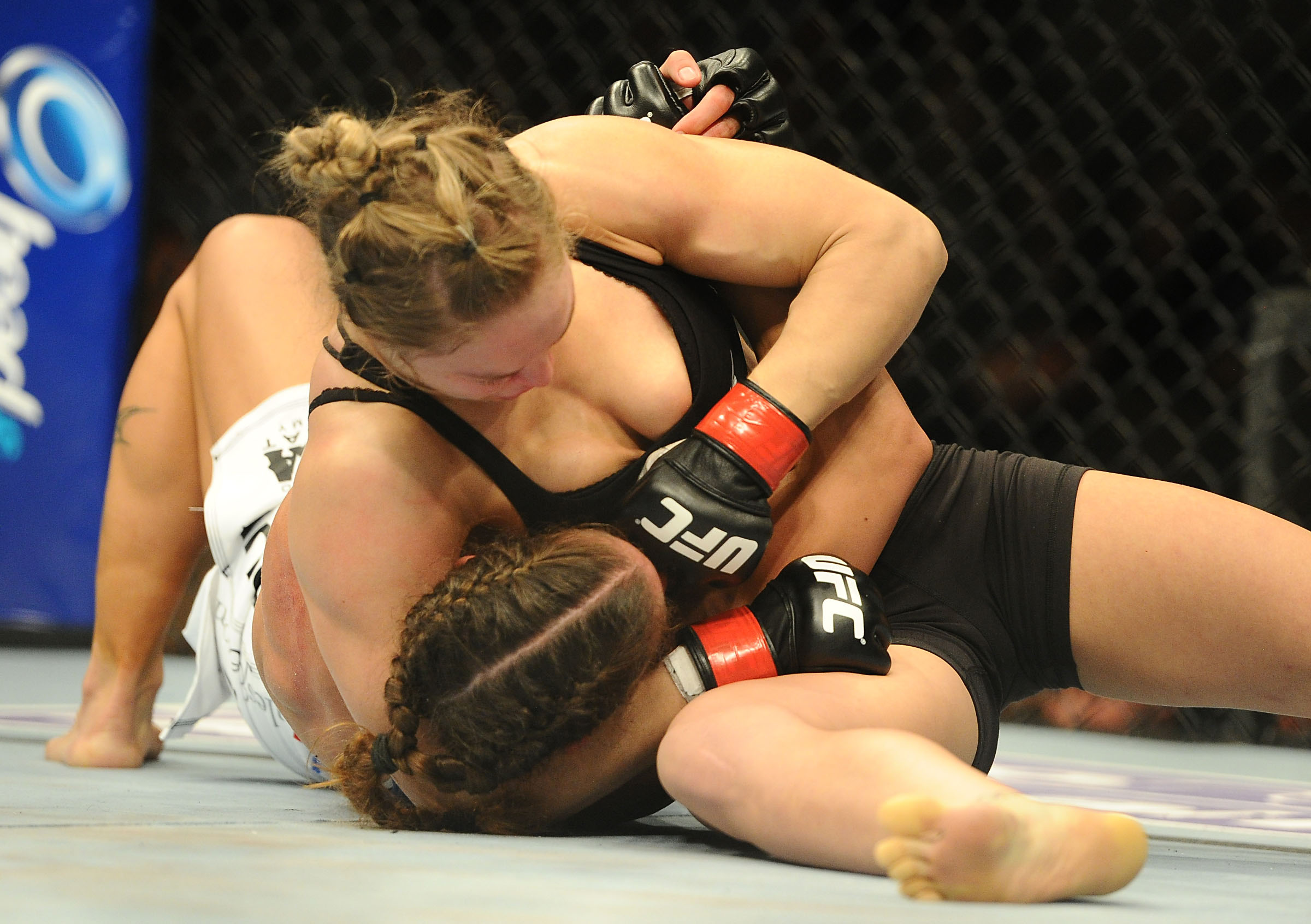 Champion Ronda Rousey (top) defeated Liz Carmouche at UFC 157 in the first women's fight in UFC history. (Jayne Kamin-Oncea-USA TODAY Sports)