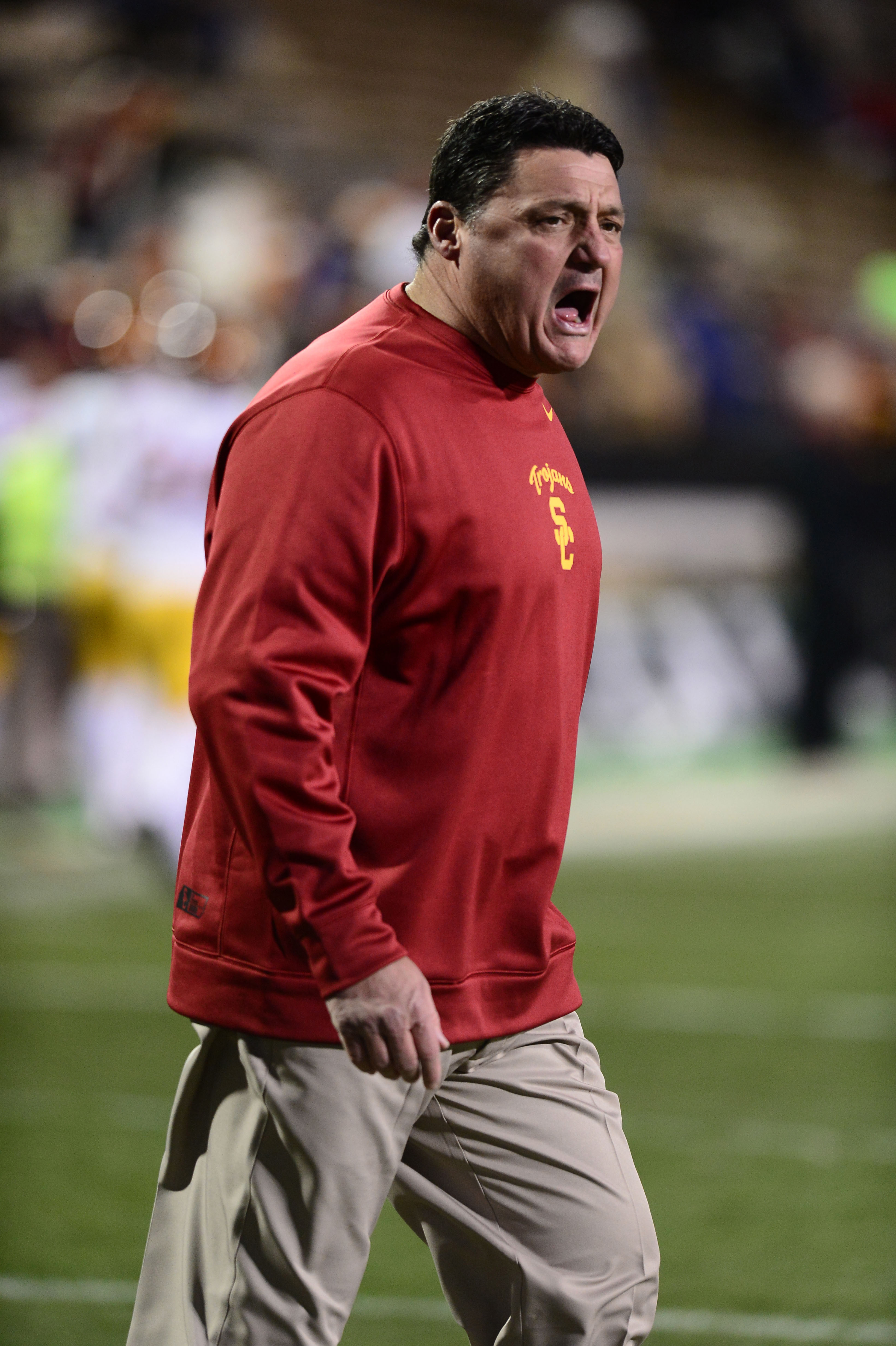 Nov 23, 2013; Boulder, CO, USA; Southern California Trojans interim head coach Ed Orgeron calls out before the game against the Colorado Buffaloes at Folsom Field. (Ron Chenoy-USA TODAY Sports)