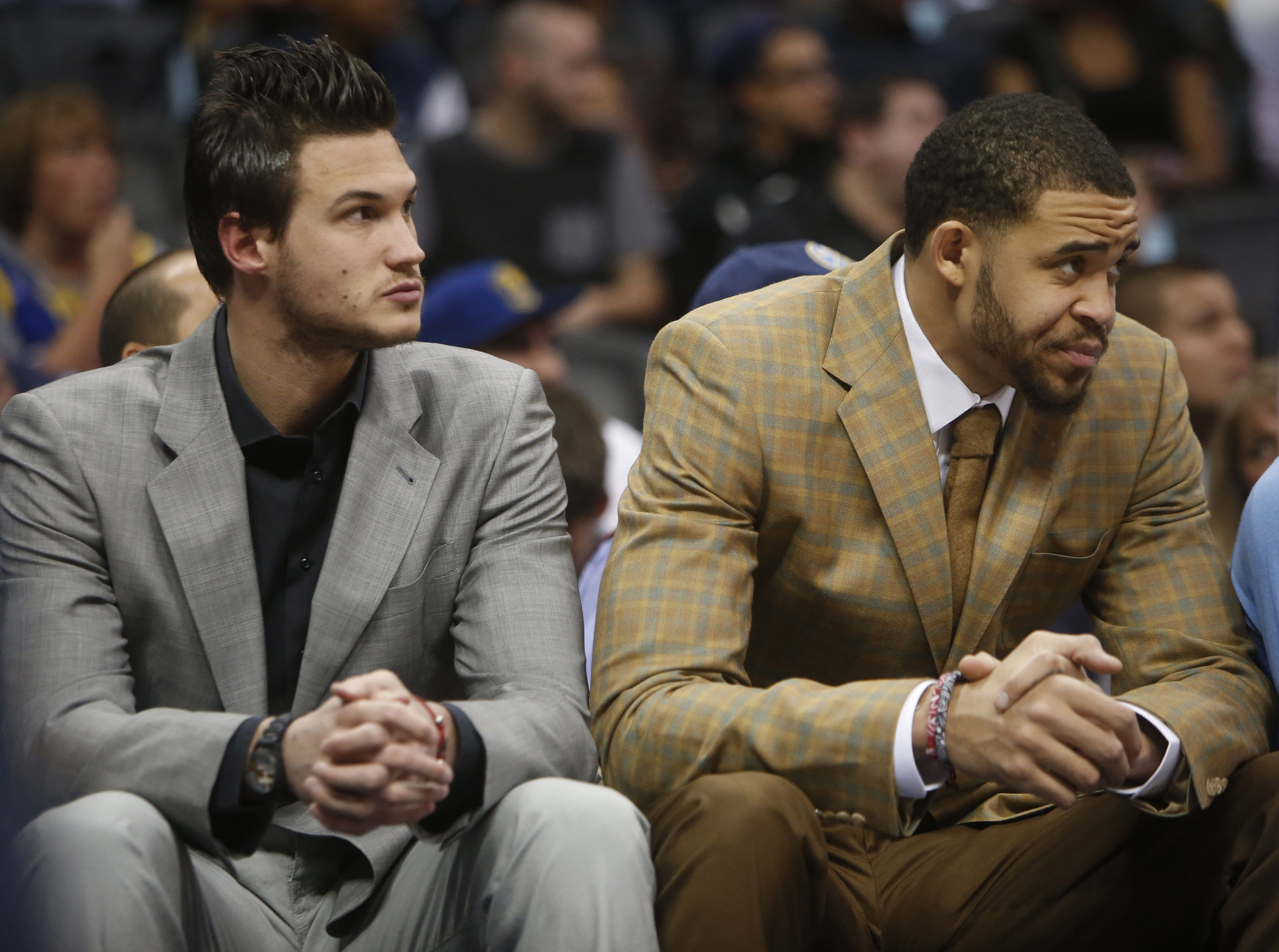 Apr 16, 2014; Denver, CO, USA; Denver Nuggets forward Danilo Gallinari (left) and center JaVale McGee (right) watch from the bench during the first quarter against the Golden State Warriors at Pepsi Center. (Chris Humphreys-USA TODAY Sports)