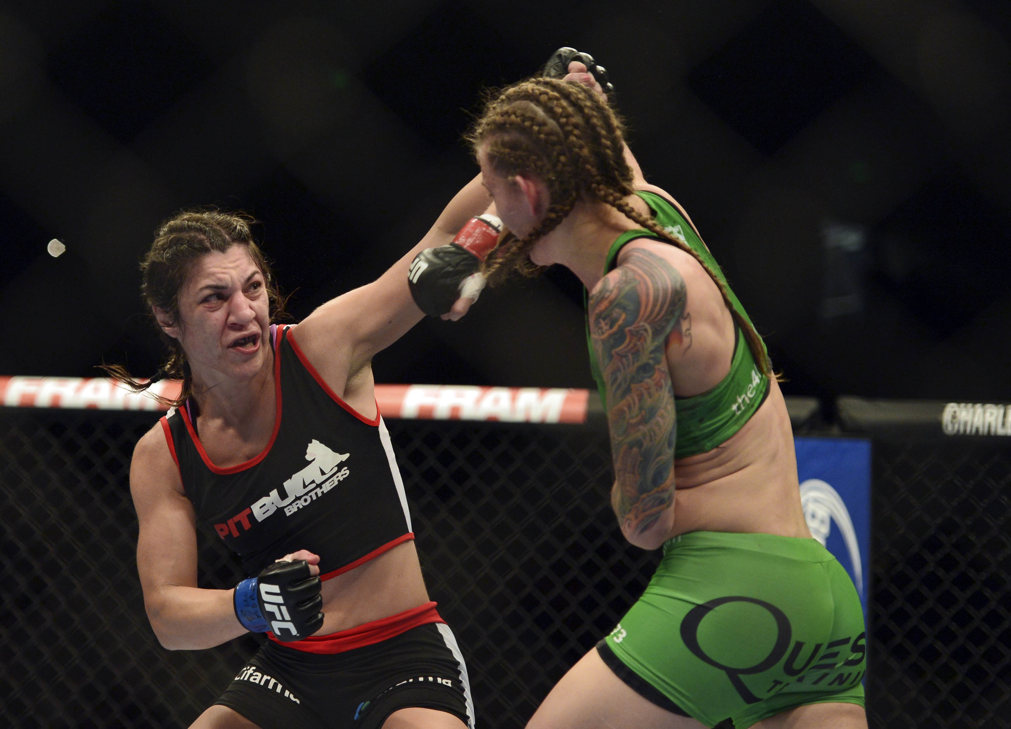 Apr 26, 2014; Baltimore, MD, USA; Bethe Correia (left) punches Ronda Rousey's teammate Jessamyn Duke. (Tommy Gilligan-USA TODAY Sports)