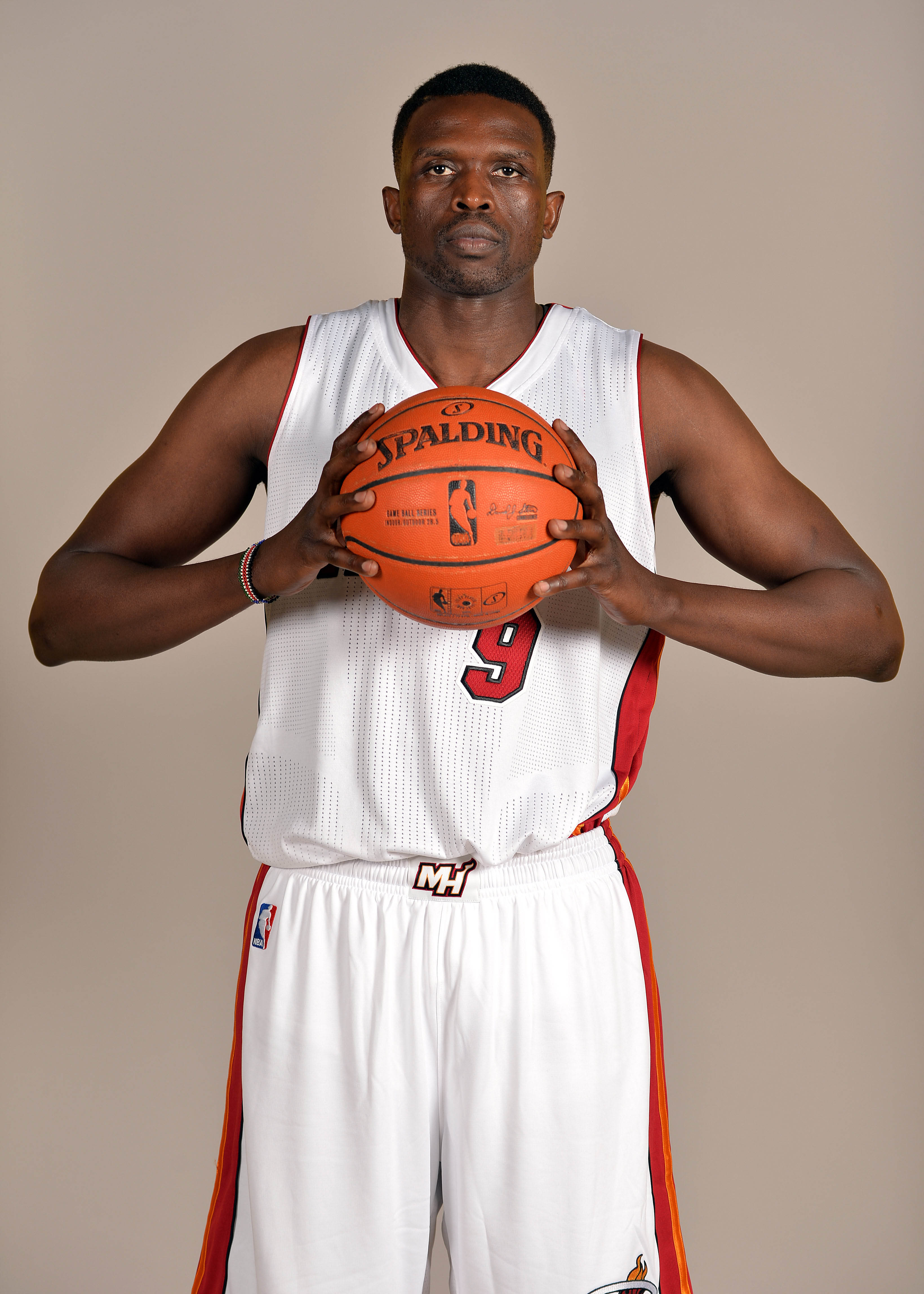Sep 26, 2014; Miami, FL, USA;Miami Heat forward Luol Deng (9) poses during photo day at American Airlines Arena. (Steve Mitchell-USA TODAY Sports)