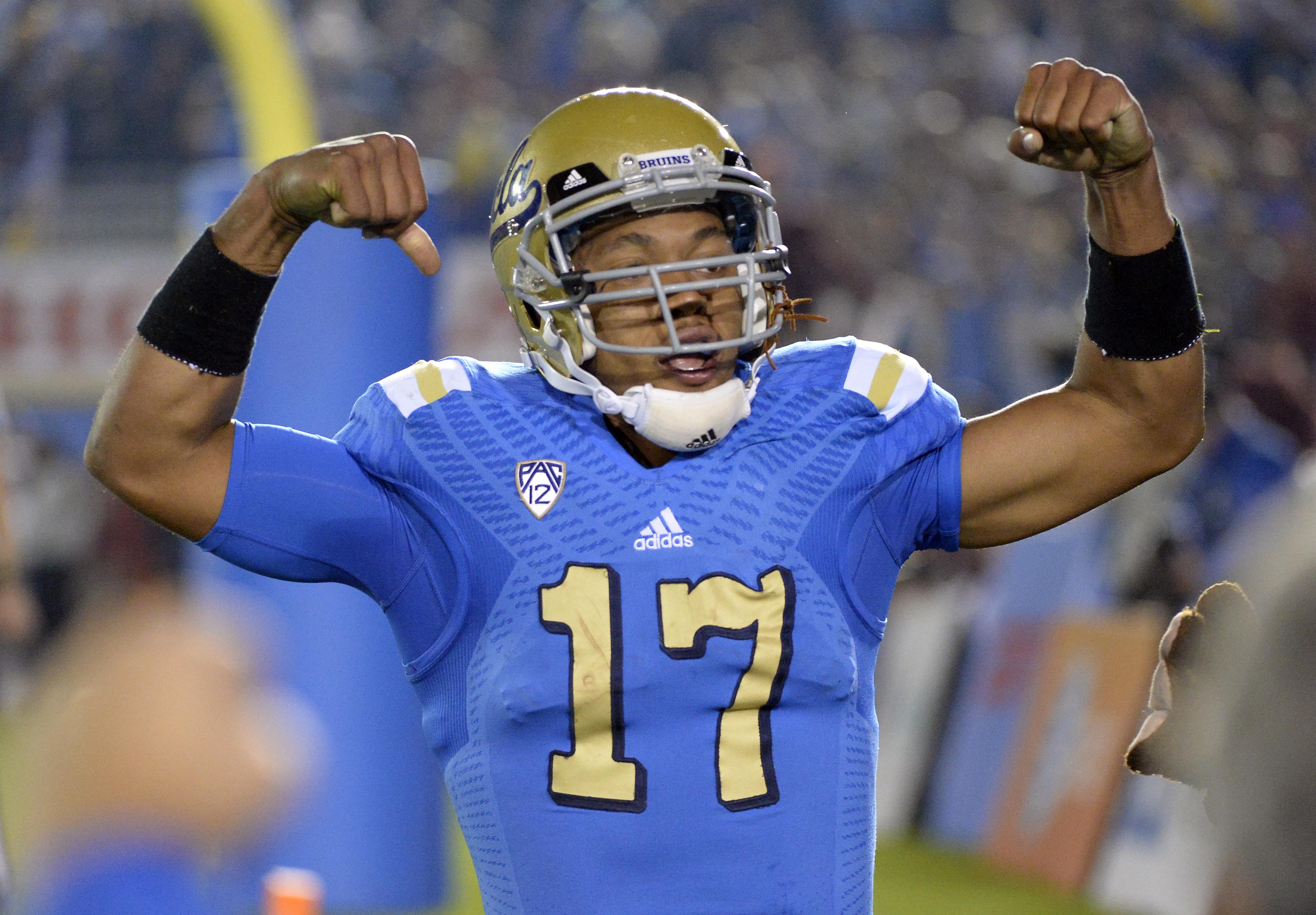 Nov 22, 2014; Pasadena, CA, USA; UCLA Bruins quarterback Brett Hundley (17) celebrates after scoring a touchdown against the Southern California Trojans during the second half at the Rose Bowl. (Richard Mackson-USA TODAY Sports)