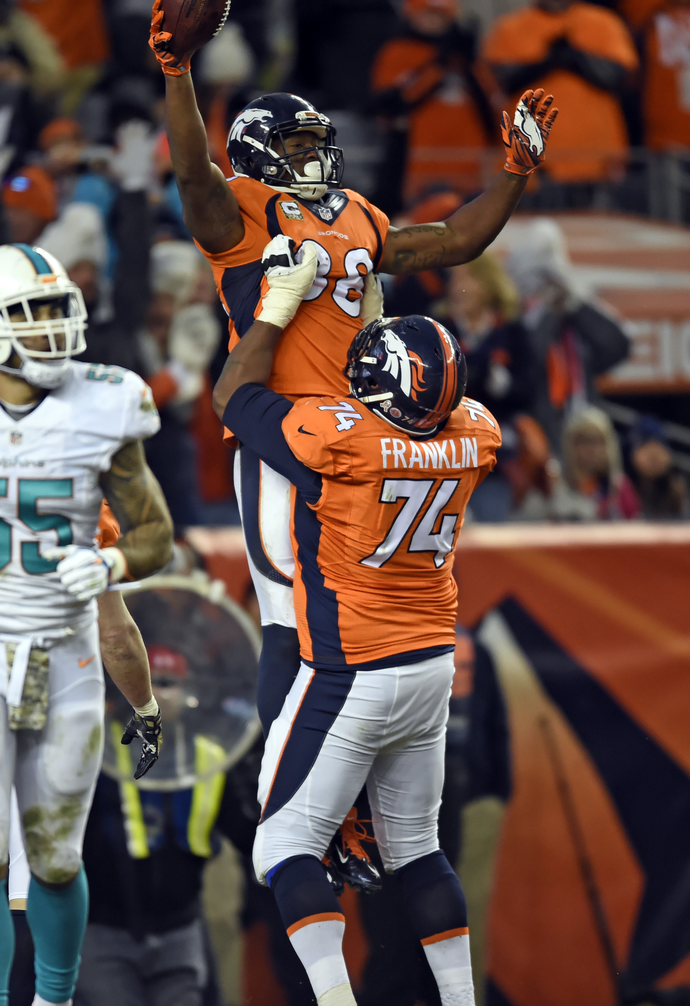 Denver Broncos wide receiver Demaryius Thomas celebrates his touchdown catch with guard Orlando Franklin in the fourth quarter against the Miami Dolphins at Sports Authority Field at Mile High. (Ron Chenoy-USA TODAY Sports)