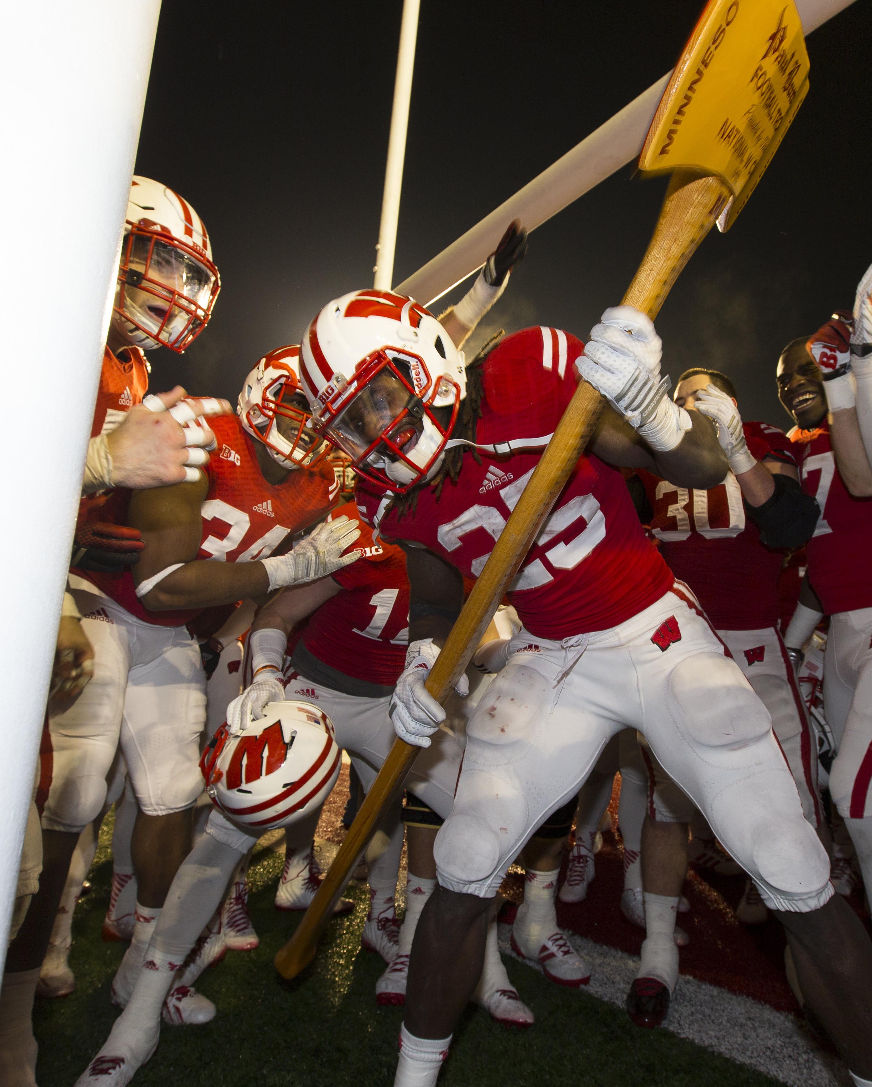 Nov 29, 2014; Madison, WI, USA; Wisconsin Badgers running back Melvin Gordon (25) celebrates with the Paul Bunyan Axe following the game against the Minnesota Golden Gophers at Camp Randall Stadium. Wisconsin won 34-24. (Jeff Hanisch-USA TODAY Sports)