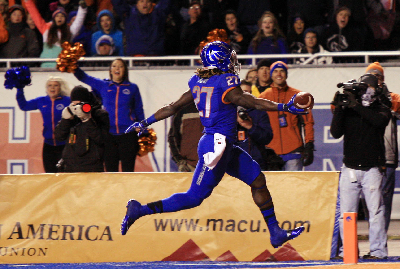 Nov 29, 2014; Boise, ID, USA; Boise State Broncos running back Jay Ajayi (27) scores his second touchdown of the first half against the Utah State Aggies at Albertsons Stadium. (Brian Losness-USA TODAY Sports )