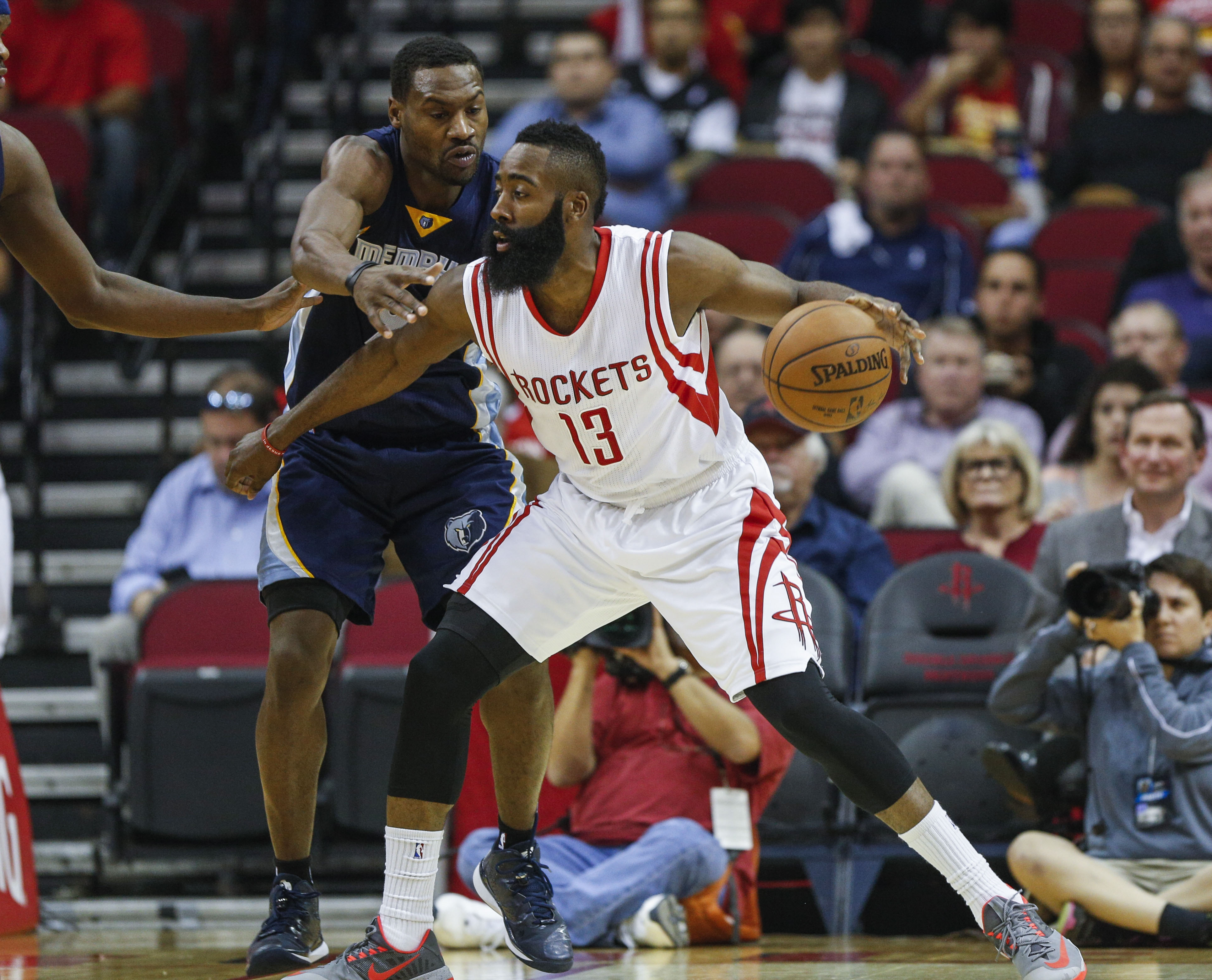 Dec 3, 2014; Houston, TX, USA; Houston Rockets guard James Harden (13) controls the ball during the first quarter as Memphis Grizzlies guard Tony Allen (9) defends at Toyota Center. (Troy Taormina-USA TODAY Sports)