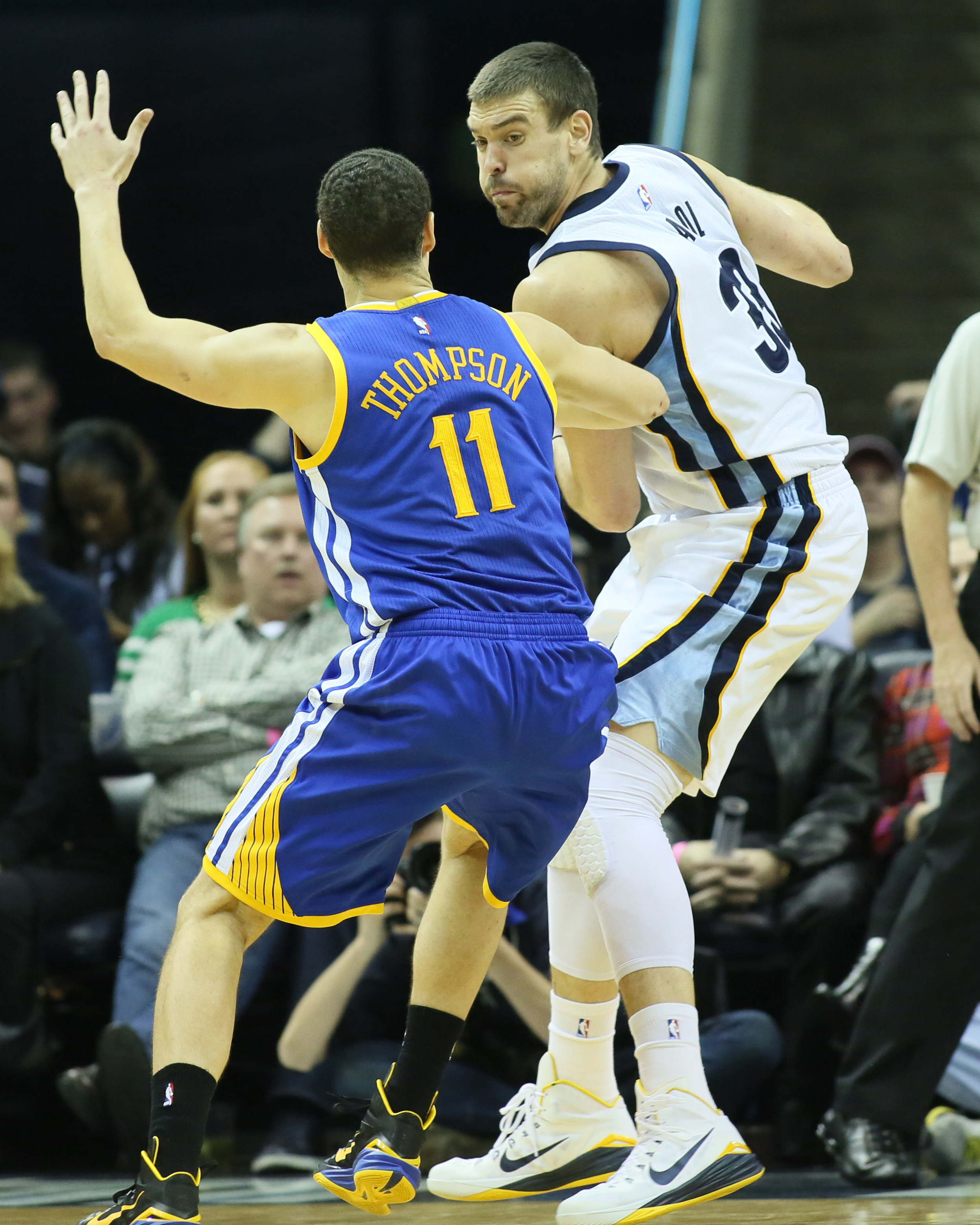 Dec 16, 2014; Memphis, TN, USA; Memphis Grizzlies center Marc Gasol (33) is defended by Golden State Warriors guard Klay Thompson (11) at FedExForum. Grizzlies defeated the Warriors 105-98. (Nelson Chenault-USA TODAY Sports)