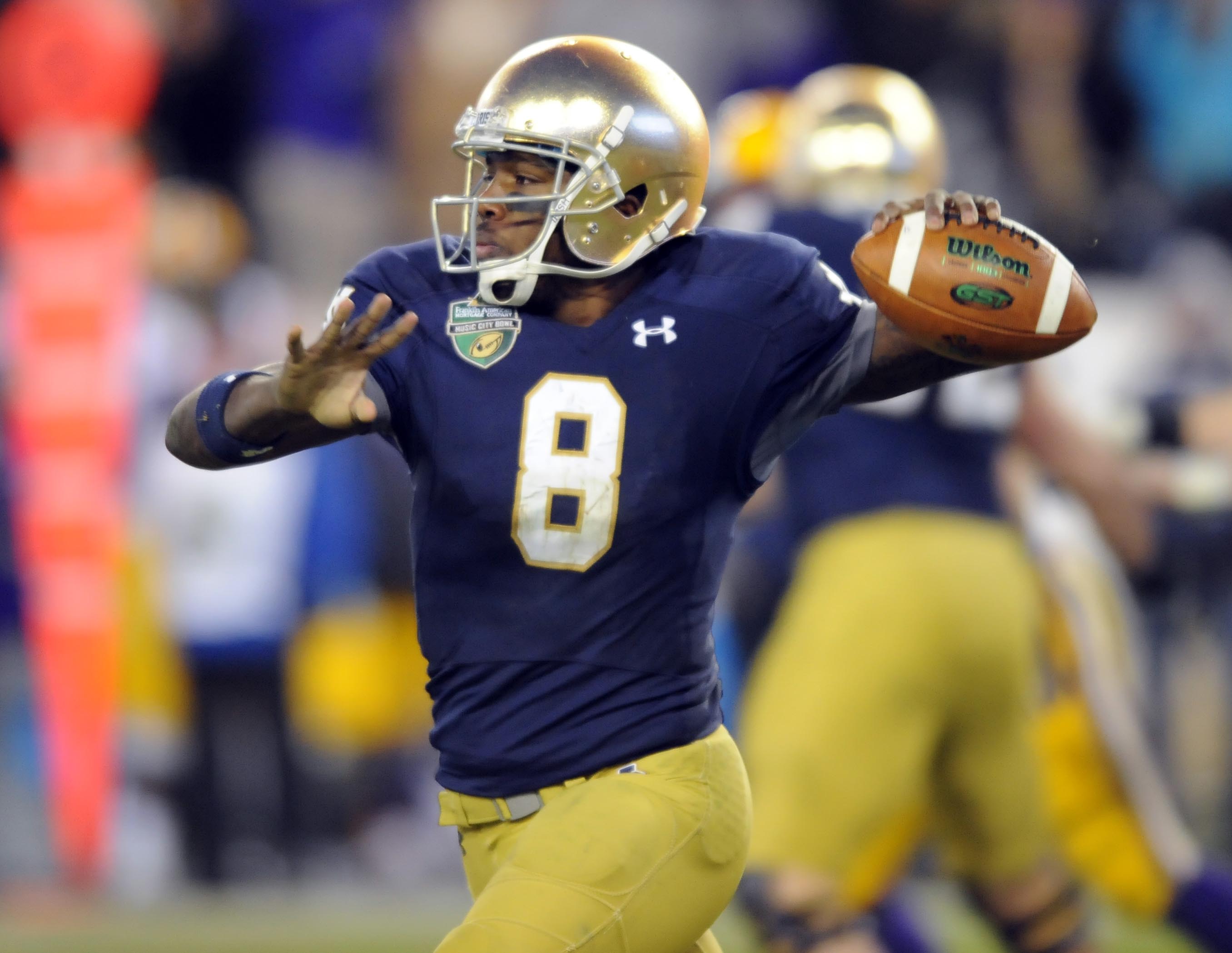 Dec 30, 2014; Nashville, TN, USA; Notre Dame Fighting Irish quarterback Malik Zaire (8) passes during the second half against the LSU Tigers in the Music City Bowl at LP Field. Notre Dame won 31-28. (Christopher Hanewinckel-USA TODAY Sports)