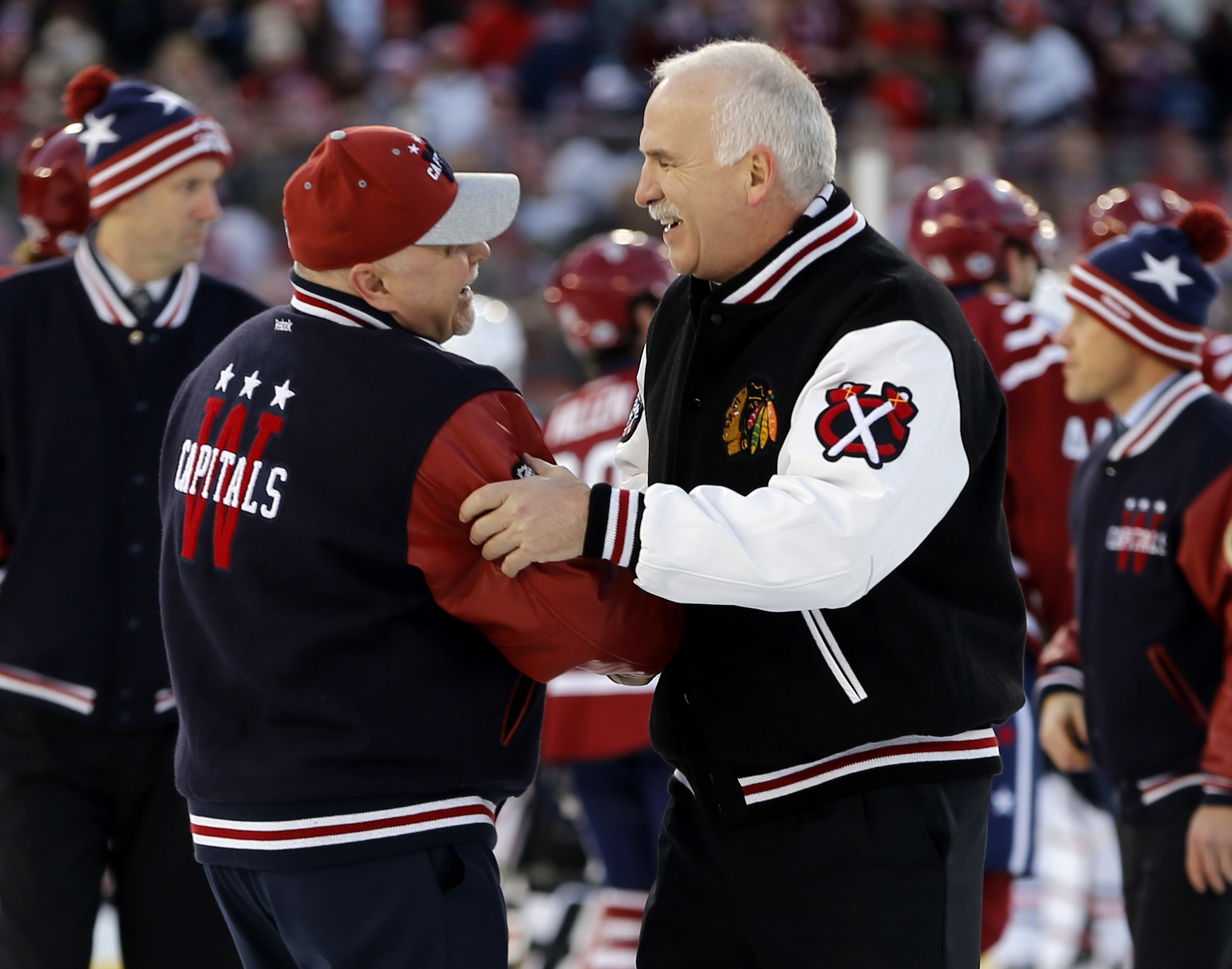 Jan 1, 2015; Washington, DC, USA; Washington Capitals head coach Barry Trotz (left) shakes hands with Chicago Blackhawks head coach Joel Quenneville (right) after the 2015 Winter Classic hockey game at Nationals Park. (Geoff Burke-USA TODAY Sports)