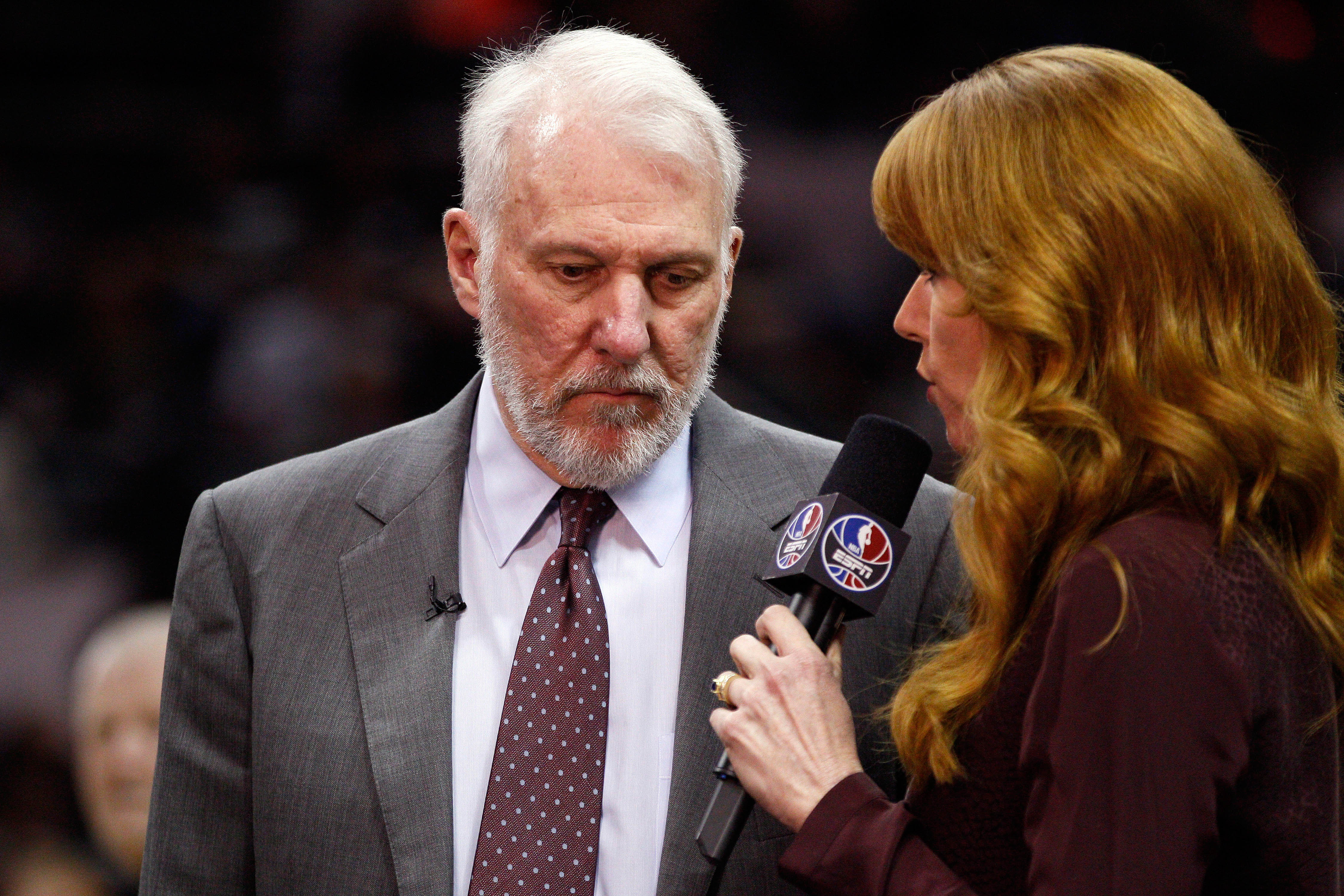 ESPNs Heather Cox (right) interviews Gregg Popovich during a game against the Clippers. (Soobum Im-USA TODAY Sports)