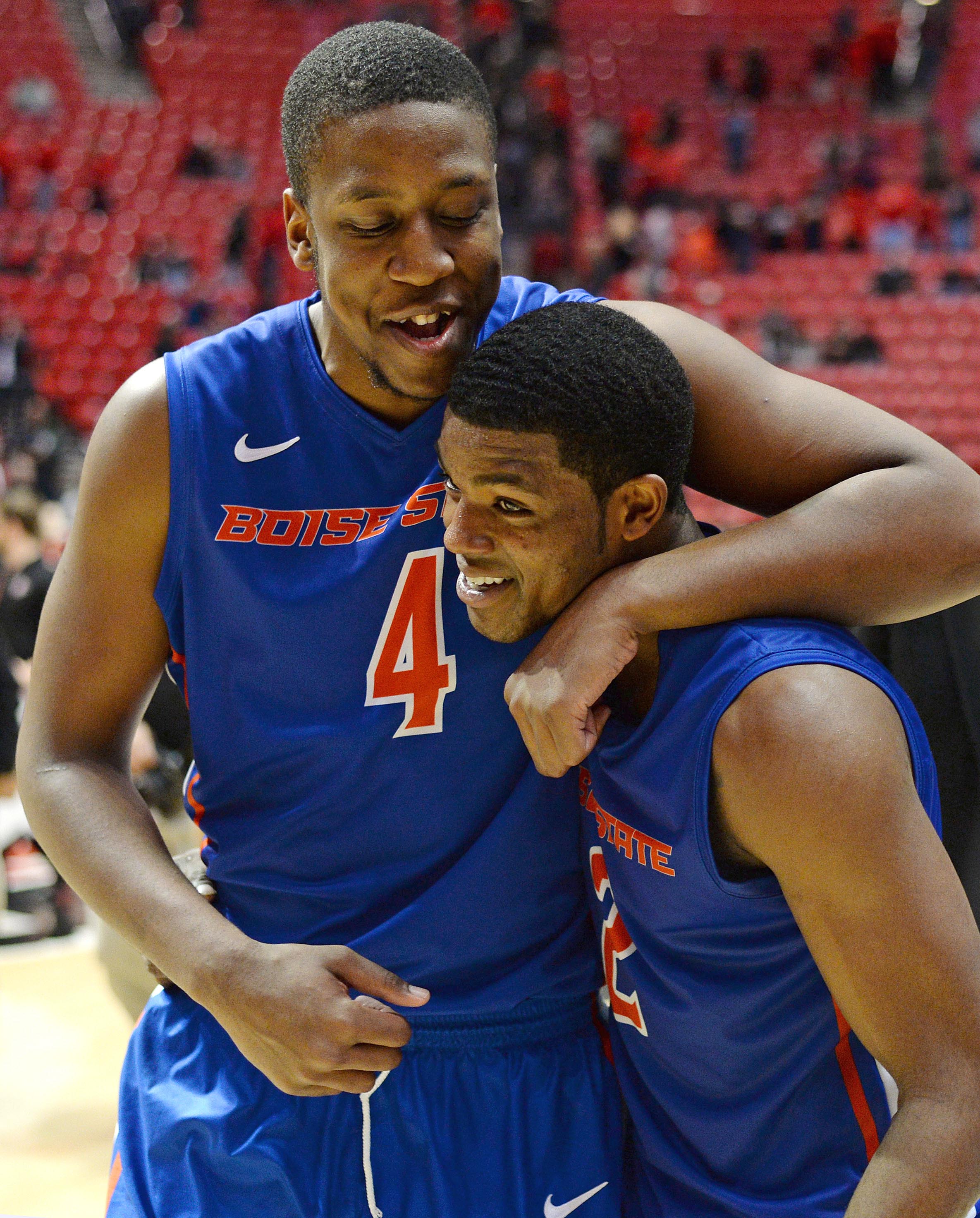 Feb 28, 2015; San Diego, CA, USA; Boise State Broncos center Kevin Allen (4) hugs guard Derrick Marks (2) after the Broncos defeated the San Diego State Aztecs 56-46 at Viejas Arena at Aztec Bowl. (Jake Roth-USA TODAY Sports)