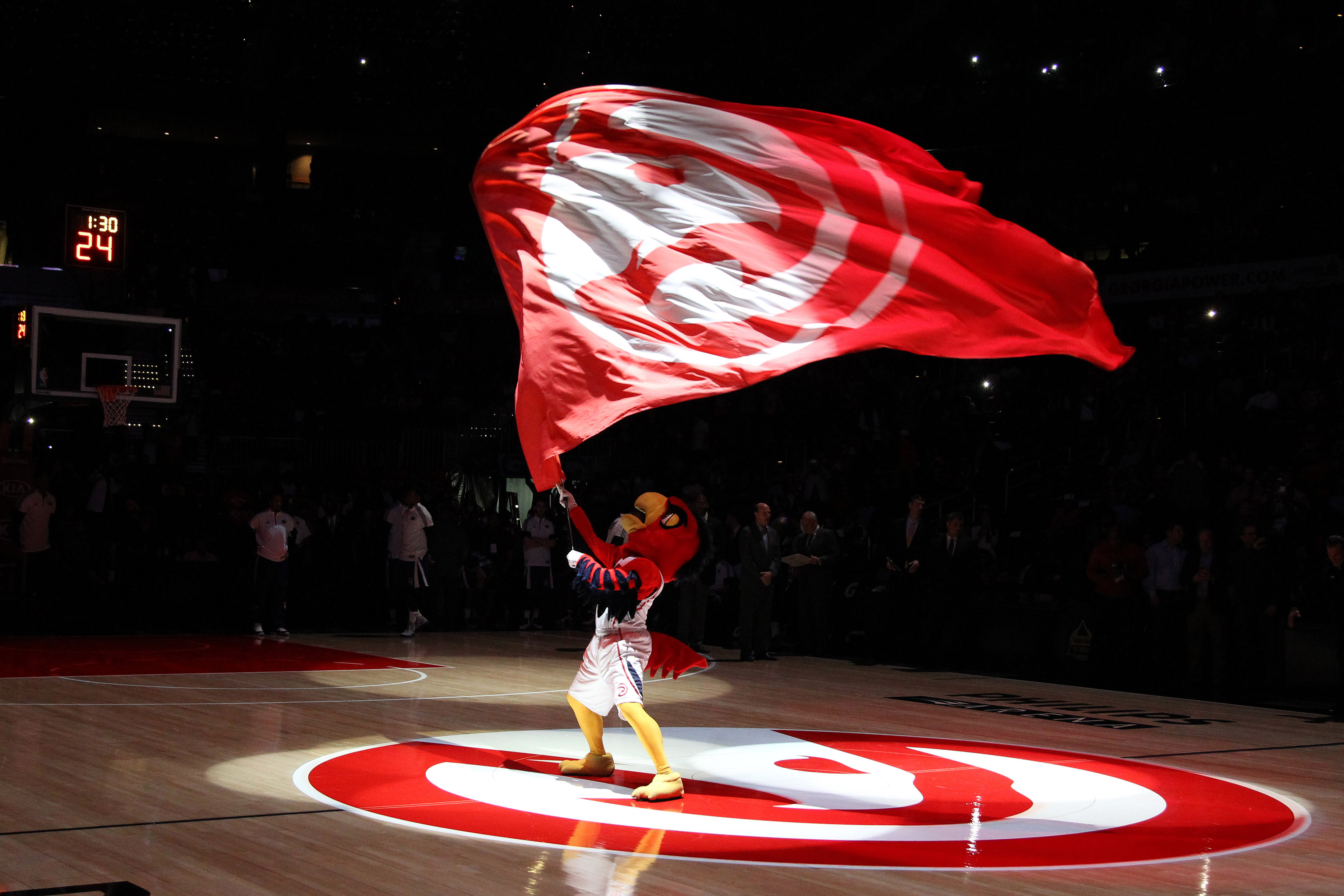 Harry Hawk waves a flag before a game against the Sacramento Kings at Philips Arena. (Brett Davis-USA TODAY Sports)