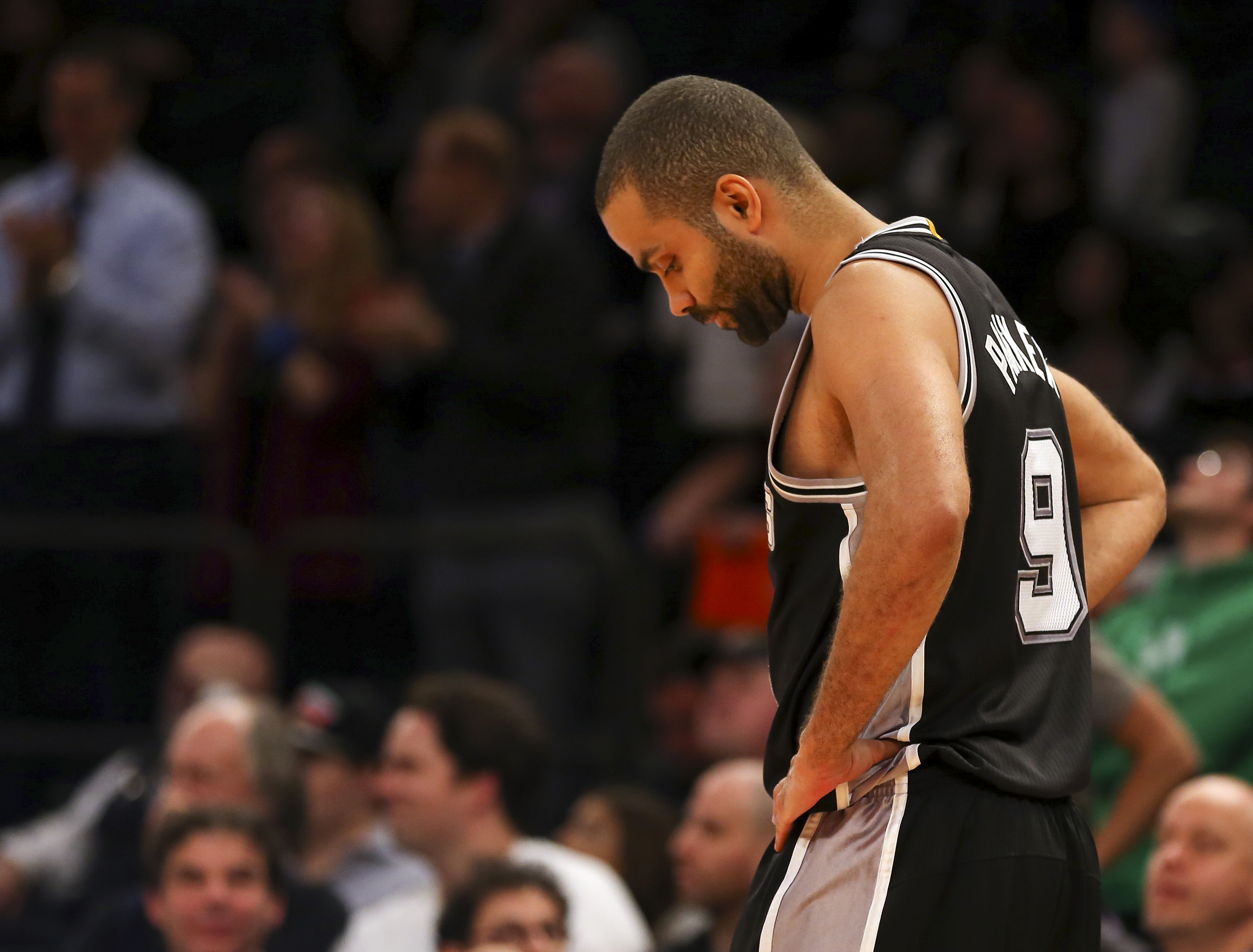 Tony Parker hangs his head. (Adam Hunger-USA TODAY Sports)
