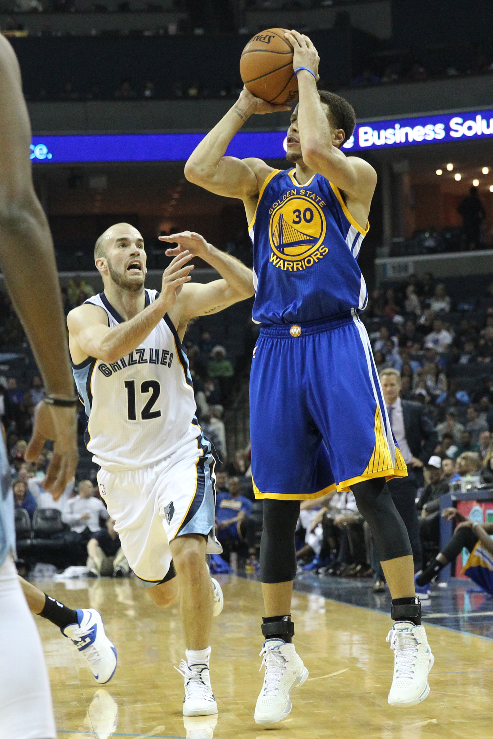 Mar 27, 2015; Memphis, TN, USA; Golden State Warriors guard Stephen Curry (30) attempts a shot in the second half against Memphis Grizzlies guard Nick Calathes (12) at FedExForum. Warriors defeated the Grizzlies 107-84. (Nelson Chenault-USA TODAY Sports)